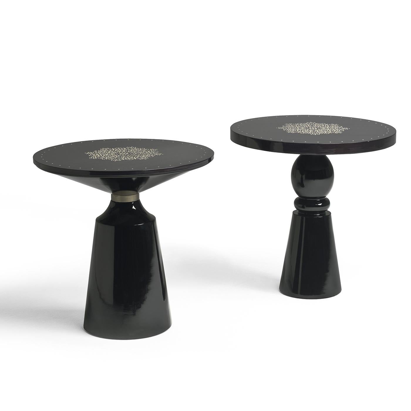 No detail has been left to chance in the Mercer Bistro Table. An exquisite addition to a modern space, the table features a glossy black finish that glistens in the light. The table is then accented with a bronze-plated brass ring that is brushed by