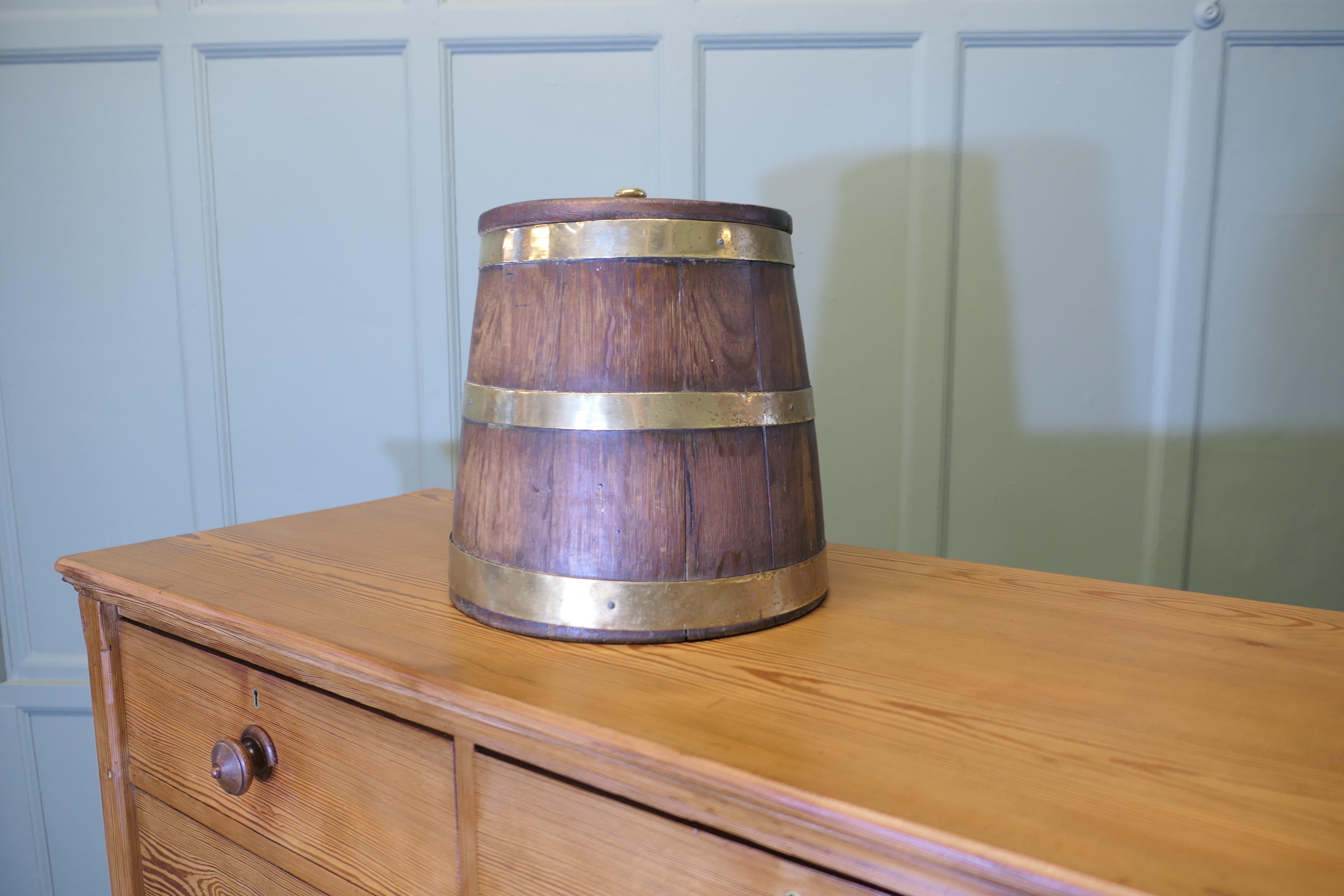 Merchant Navy “Grog Tub”, Oak and Brass Sailor’s Rum Barrel

A super piece and an essential to the sailors, the barrel known as a “Grog Tub” a tot of rum was given from this to the sailors from time to time 
A lovely piece made in oak with Brass