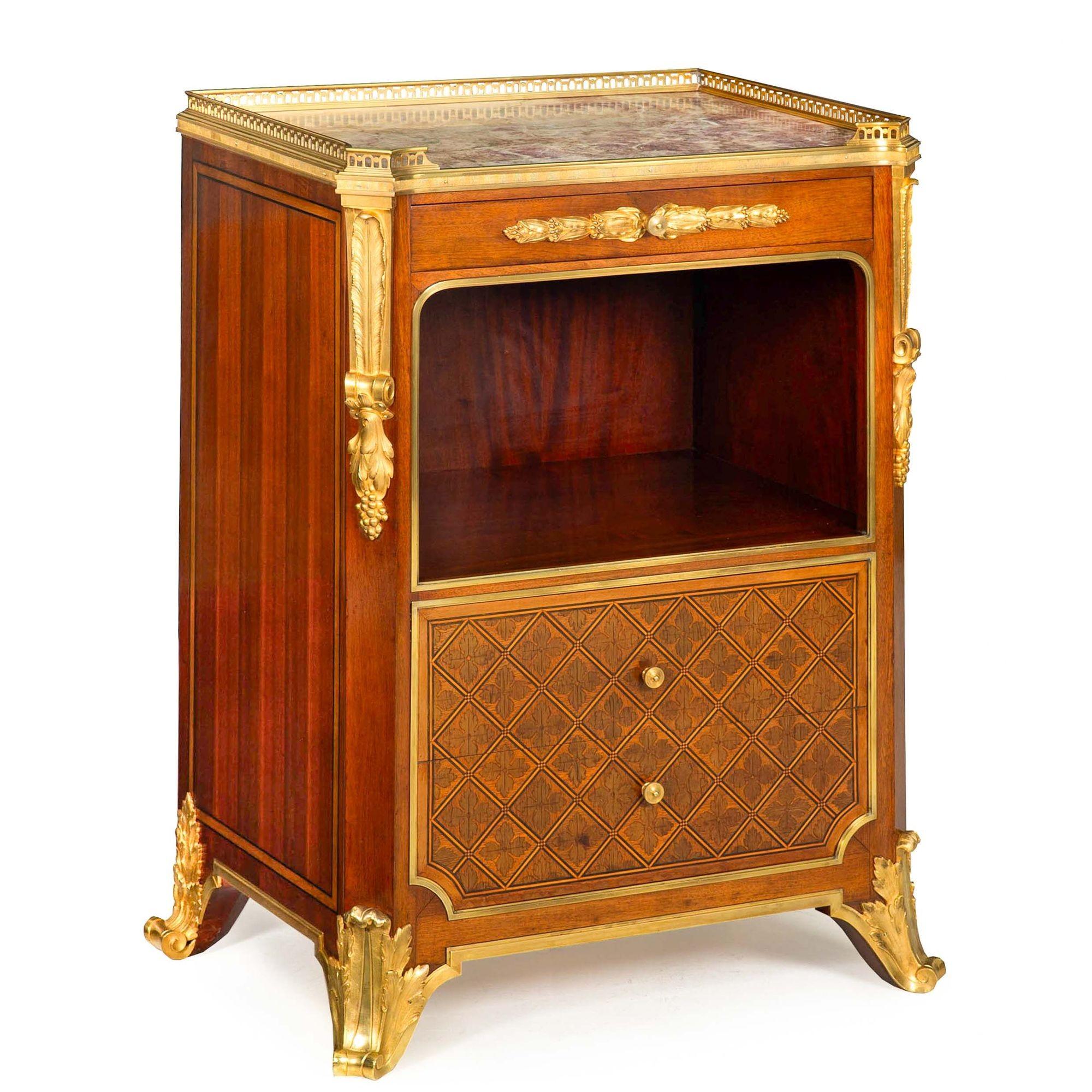 LOUIS XVI STYLE ORMOLU-MOUNTED PARQUETRY INLAID BEDSIDE CABINET WITH BRECHE VIOLLETT MARBLE TOP
Retailed by Mercier Frères, labeled inside drawer  circa early 20th century  label on reverse 14982 (same number stamped and written on the cabinet) 