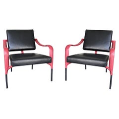 Jacques Adnet & Mercier Frères, pair of black and red leather chairs, France
