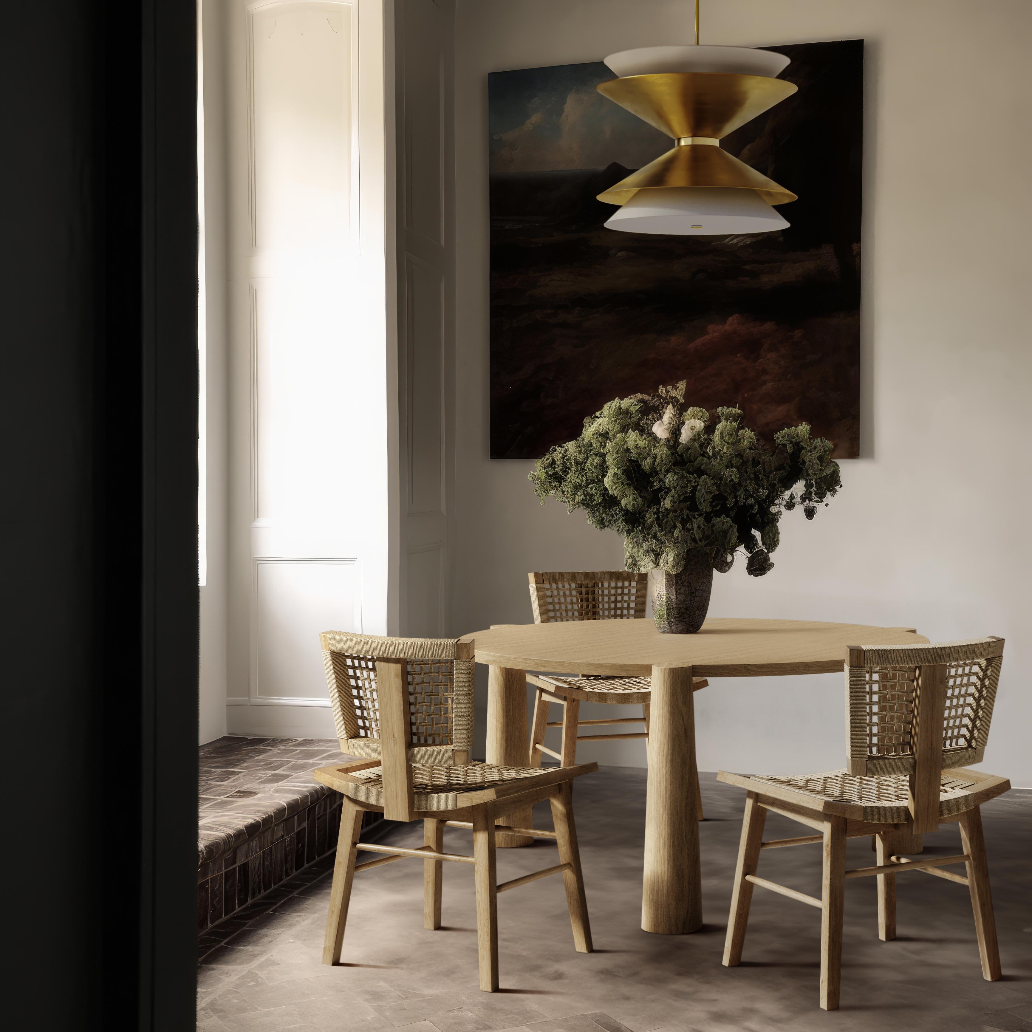 The Mercier chair is a solid Oak dining chair featuring a handwoven seat and back, perfectly contoured for optimal seating comfort. Its modern silhouette is reminiscent of the iconic designs by Pierre Jeanneret, blending classic inspiration with