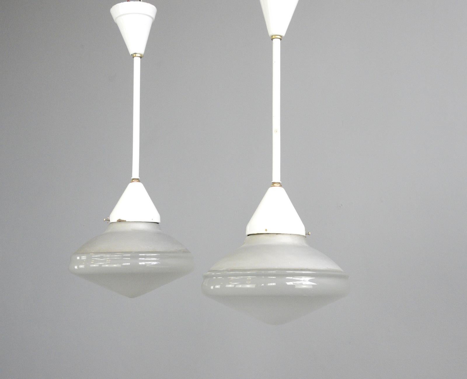 Mercury glass and enamel pendant lights by Phillips, circa 1920s

- Price is per light (2 available)
- Mercury glass top and acid etched bottom
- Original vitreous white enamel stems
- Takes E27 fitting bulbs
- Originally from a butchers shop