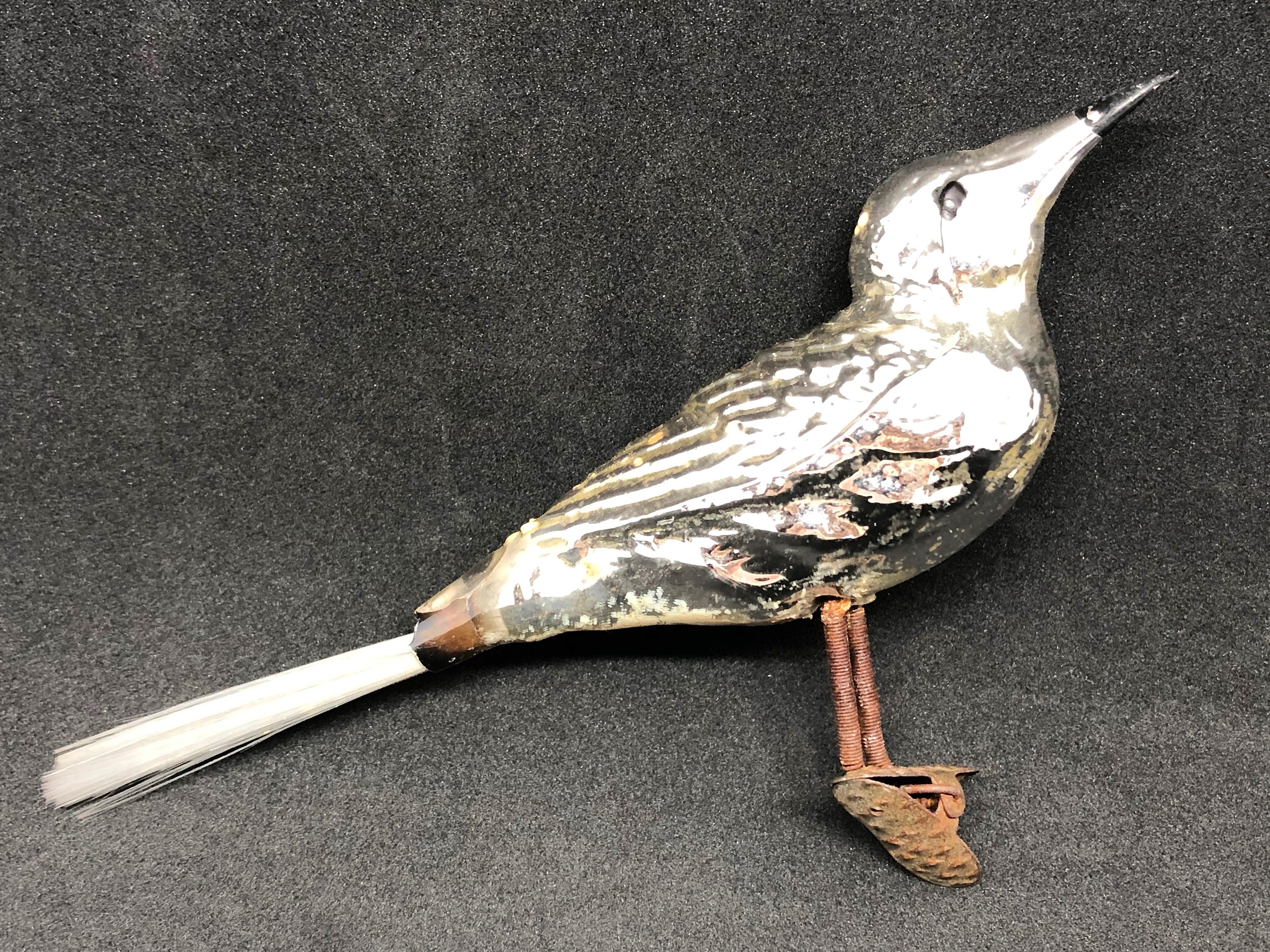 An antique clip on bird ornament in larger version. This ornament, made from ultra-thin hand blown mercury glass, would be a great antique addition for your Christmas, feather tree or sitting on a decorative branch in your bathroom or hall way.  