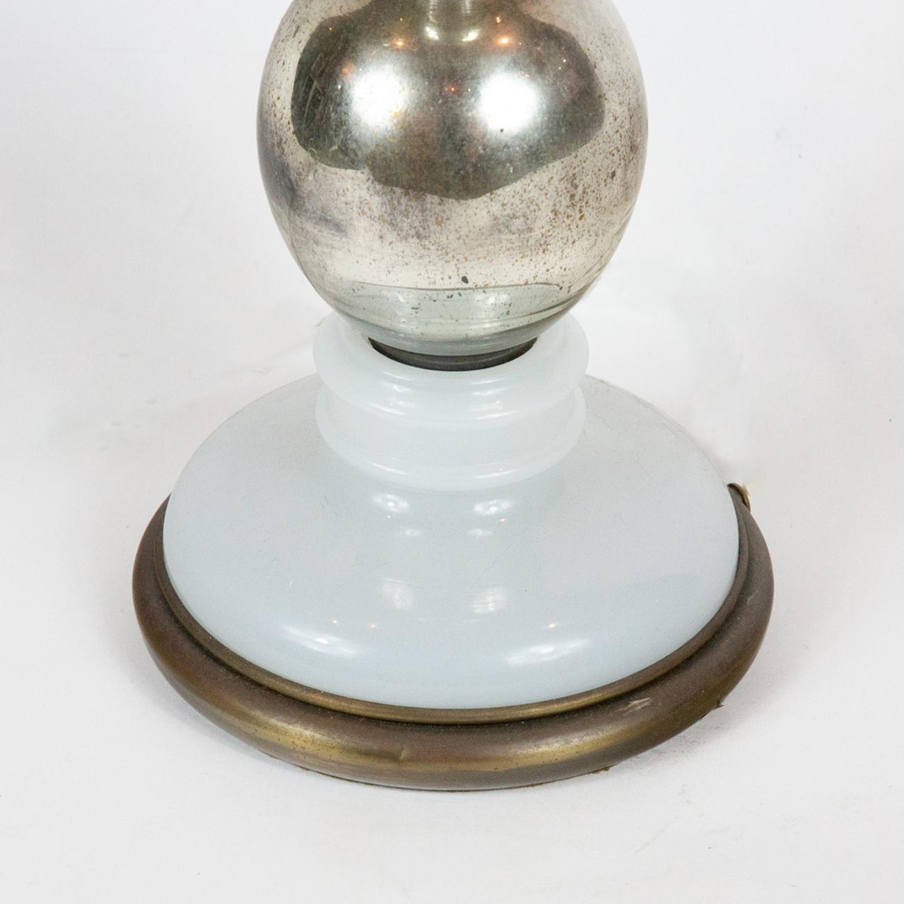 Mercury glass brass spigot lamp. Antique lamp with black shade. Measures: 36
