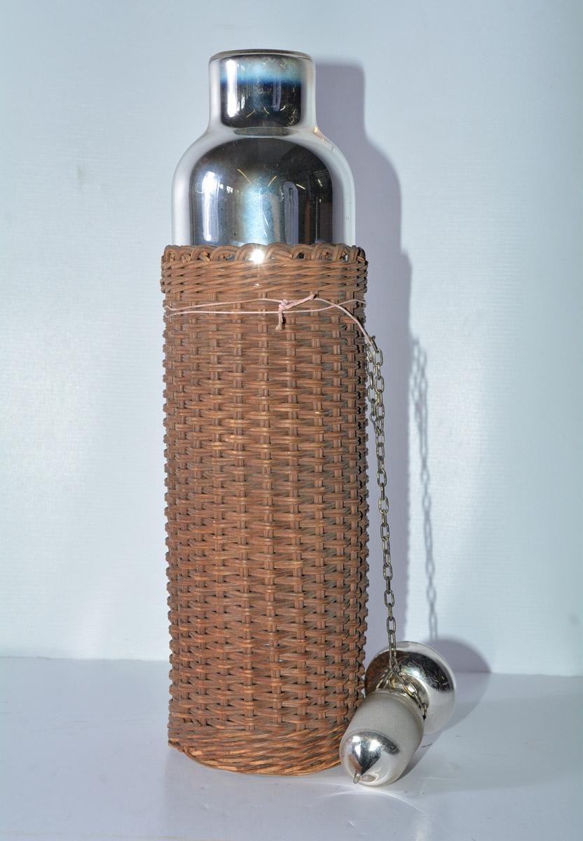 Unusual vintage mercury thermos with wicker outer layer.
OFFERING FREE SHIPPING TO CONTINENTAL US.  PLEASE JUST ASK FOR A SHIPPING QUOTE.