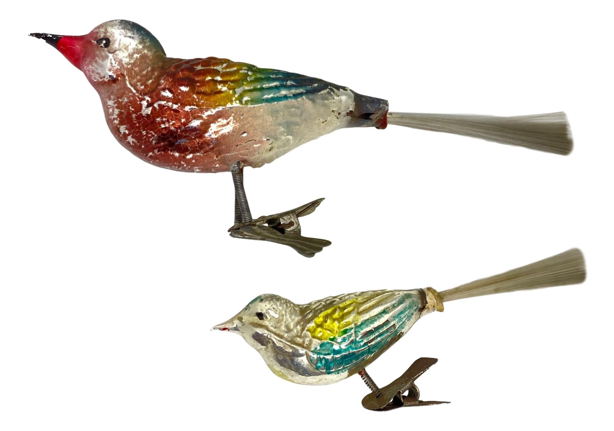 A rare antique clip-on bird ornament in large version and a smaller one. Tall one measures approx. 3