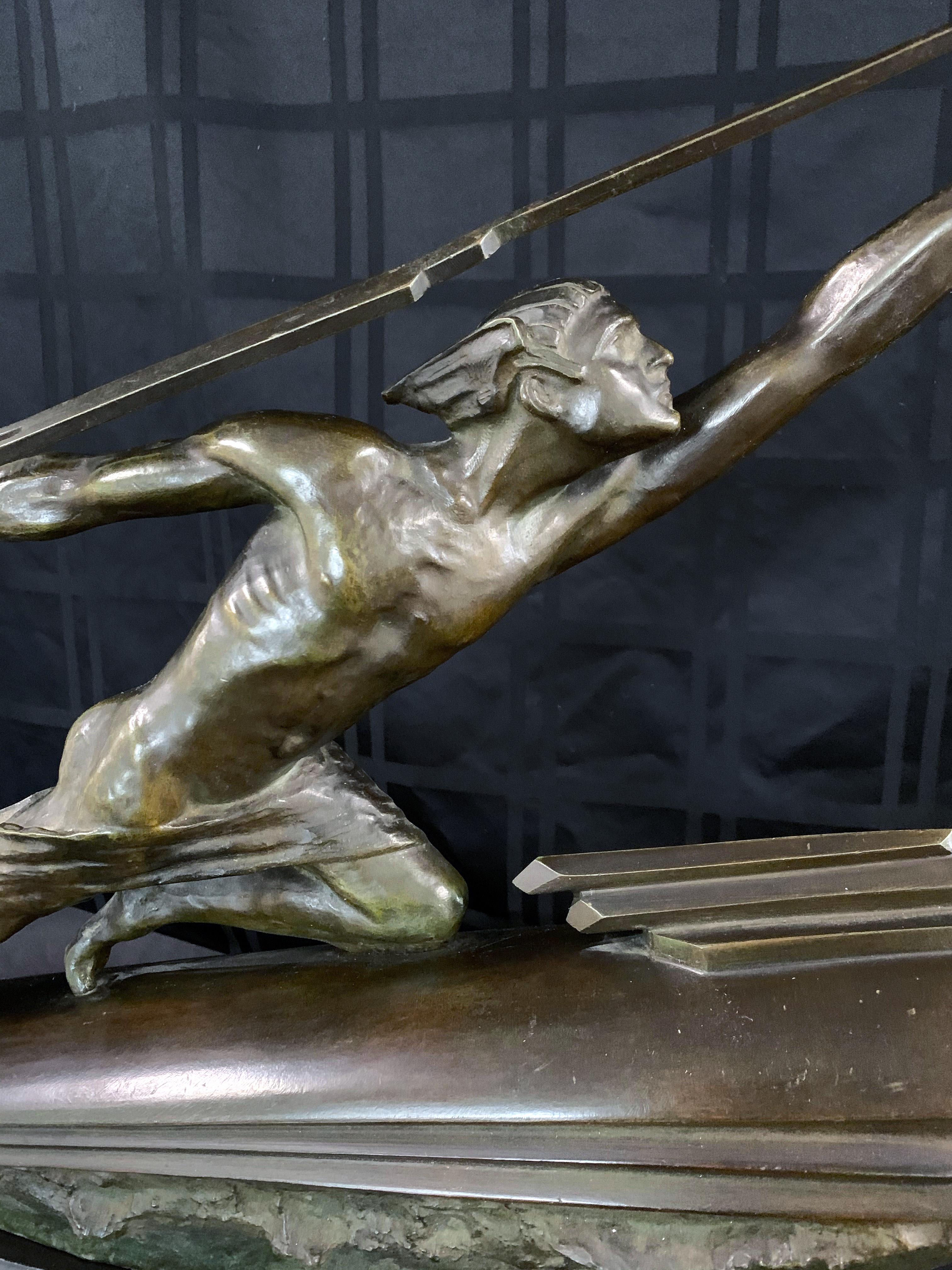 Truly spectacular in its size and execution, this 36-inch wide bronze sculpture depicts a stylized, nude Mercury figure holding a bolt of lightning and riding an Art Deco rocket reminiscent of early, streamlined power boats in the 1930s. Of course