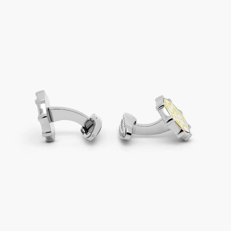 Mercury yellow leather cufflinks in titanium

Named after the Roman deity Mercury, the messenger of the gods, this textured cufflink collection uses yellow and white-coloured leather to create the planets surface in a fun, contemporary style.