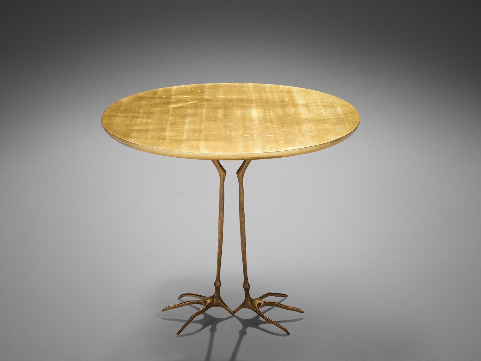 Méret Oppenheim for Simon Gavina, 'Traccia' coffee table, in bronze, gold leaf and wood, Italy, 1970s.

This side table by surrealist artist Méret Oppenheim is part of the 1972 serial production, called 'Ultramobile', of the original design she made