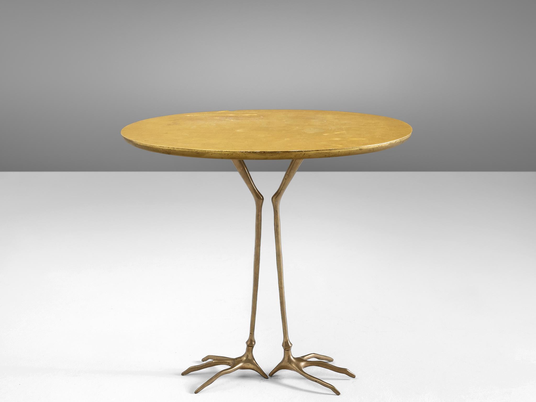 Méret Oppenheim for Simon Gavina, 'Traccia' coffee table, in bronze, gold leaf and wood, Italy, 1970s.

This side table by surrealist artist Méret Oppenheim is part of the 1972 serial production, called 'Ultramobile', of the original design she