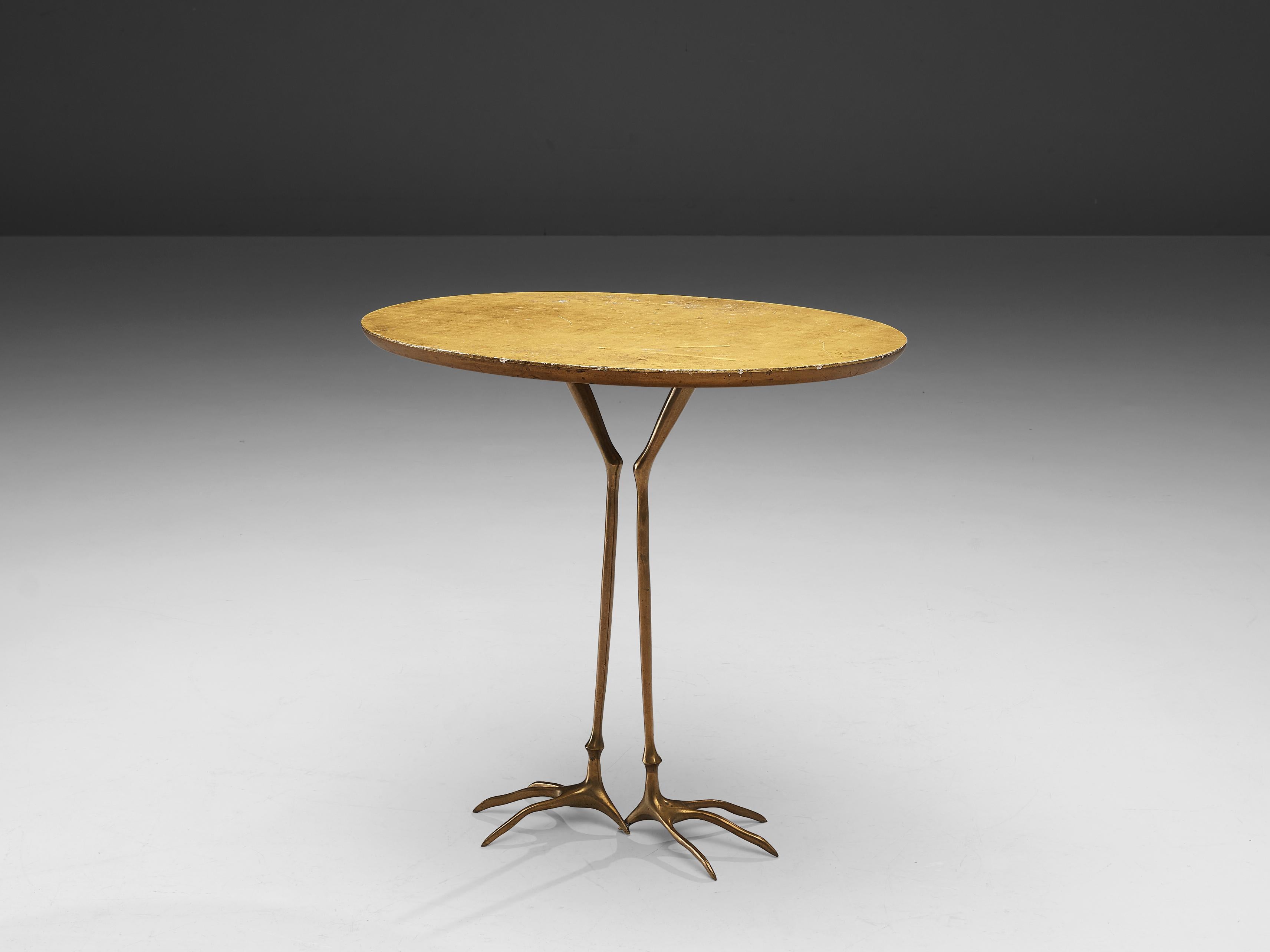 Meret Oppenheim, 'Traccia' coffee table, gilded wood, brass, Italy, design 1939 

This surrealistic side table is designed by one of the most renowned Surrealist artists Meret Oppenheim (1913-1985). The gilded wood top is in the shape of a golden