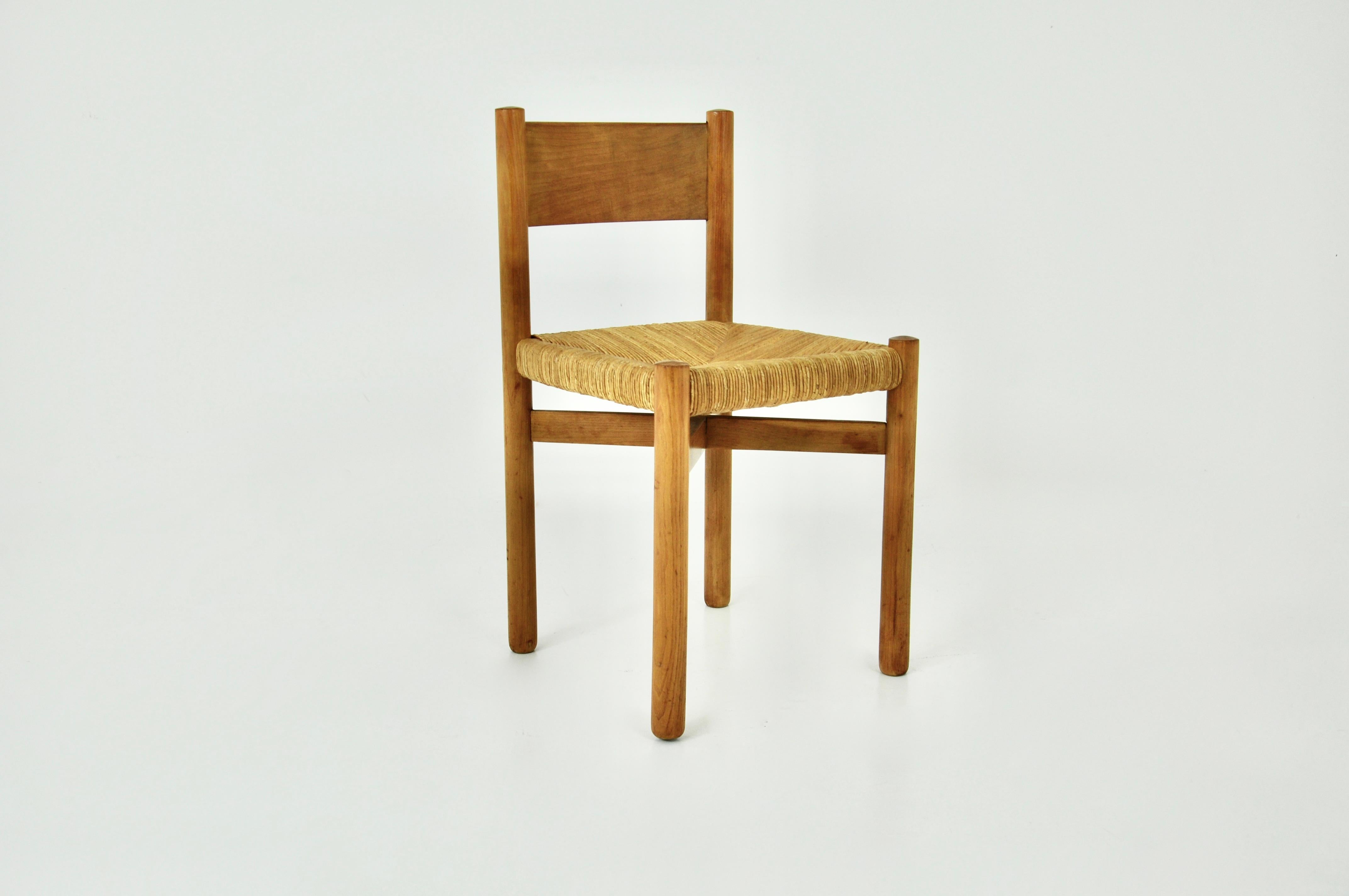 Wooden chair with straw seat designed by Charlotte Perriand in the 1950s, model: Meribel. Seat height: 46 cm. Wear due to time and age of the chair.