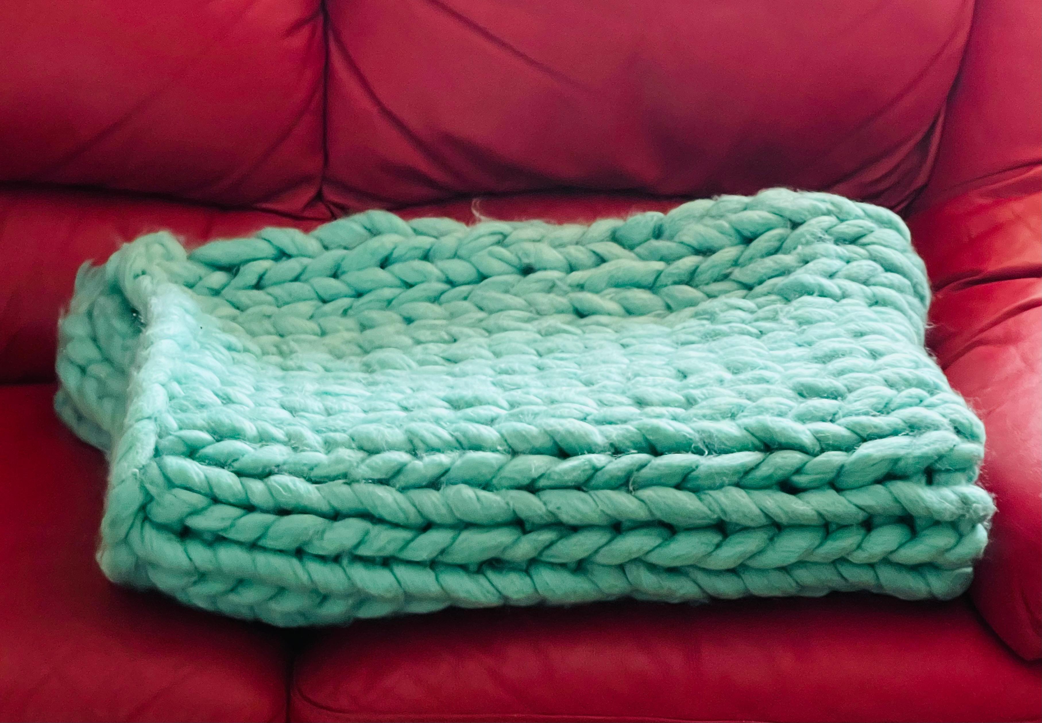 Pure merino wool hand knit huge loops handmade blanket or throw. Heavy and soft. Very warm. Great decor pi. Beautiful turquoise color.  Great condition 