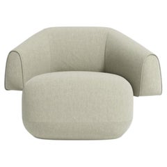 Meritalia Hug Armchair Upholstered in fabric by Cristián Mohaded