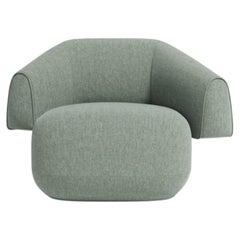 Meritalia Hug Armchair Upholstered in fabric by Cristián Mohaded