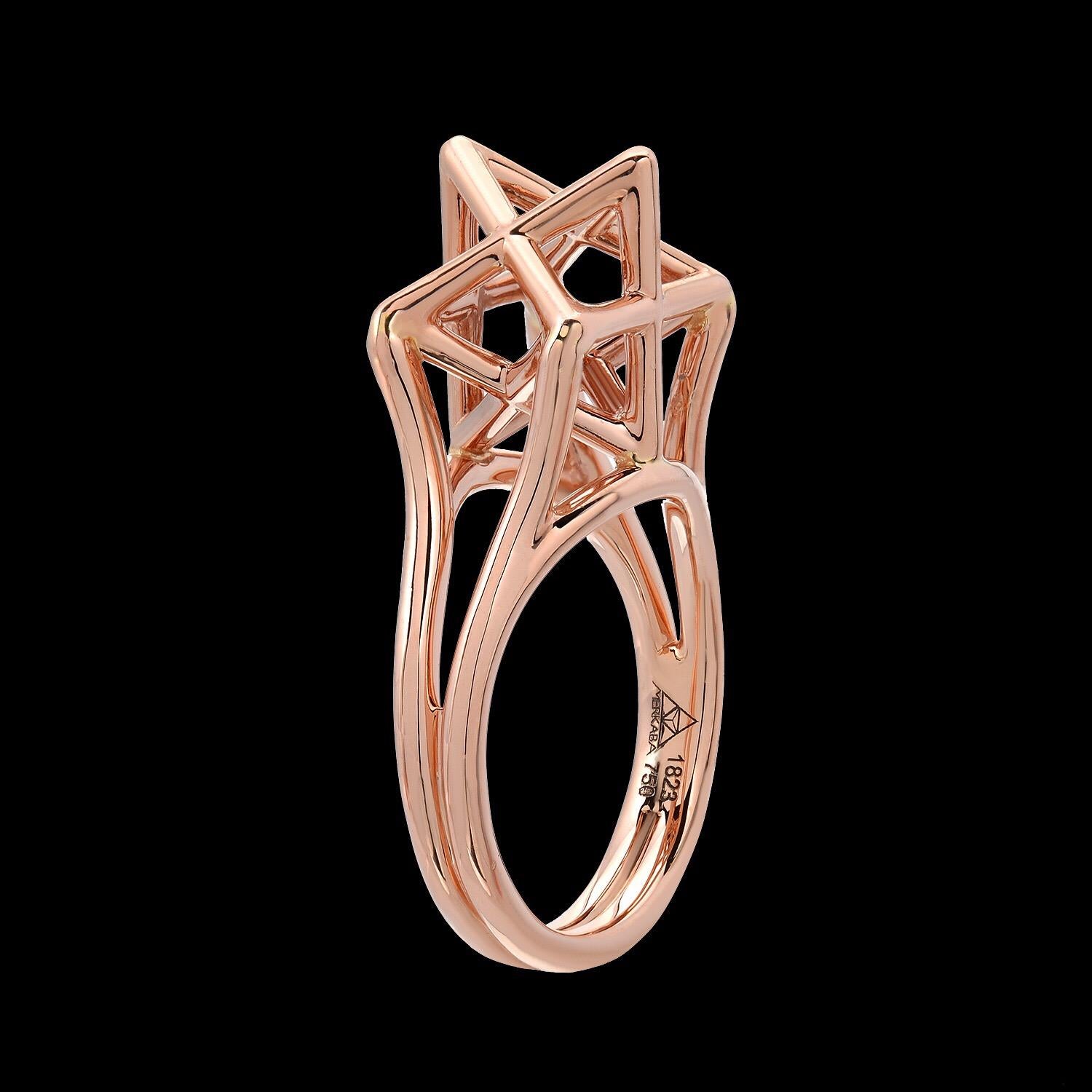 Merkaba three dimensional star tetrahedron, 18K rose gold ring, featuring a dramatic, sculptural design, extending upward from the hand 0.43”, a stunning three-dimensional symbol of universal light. 
Size 6. Resizing is complimentary upon