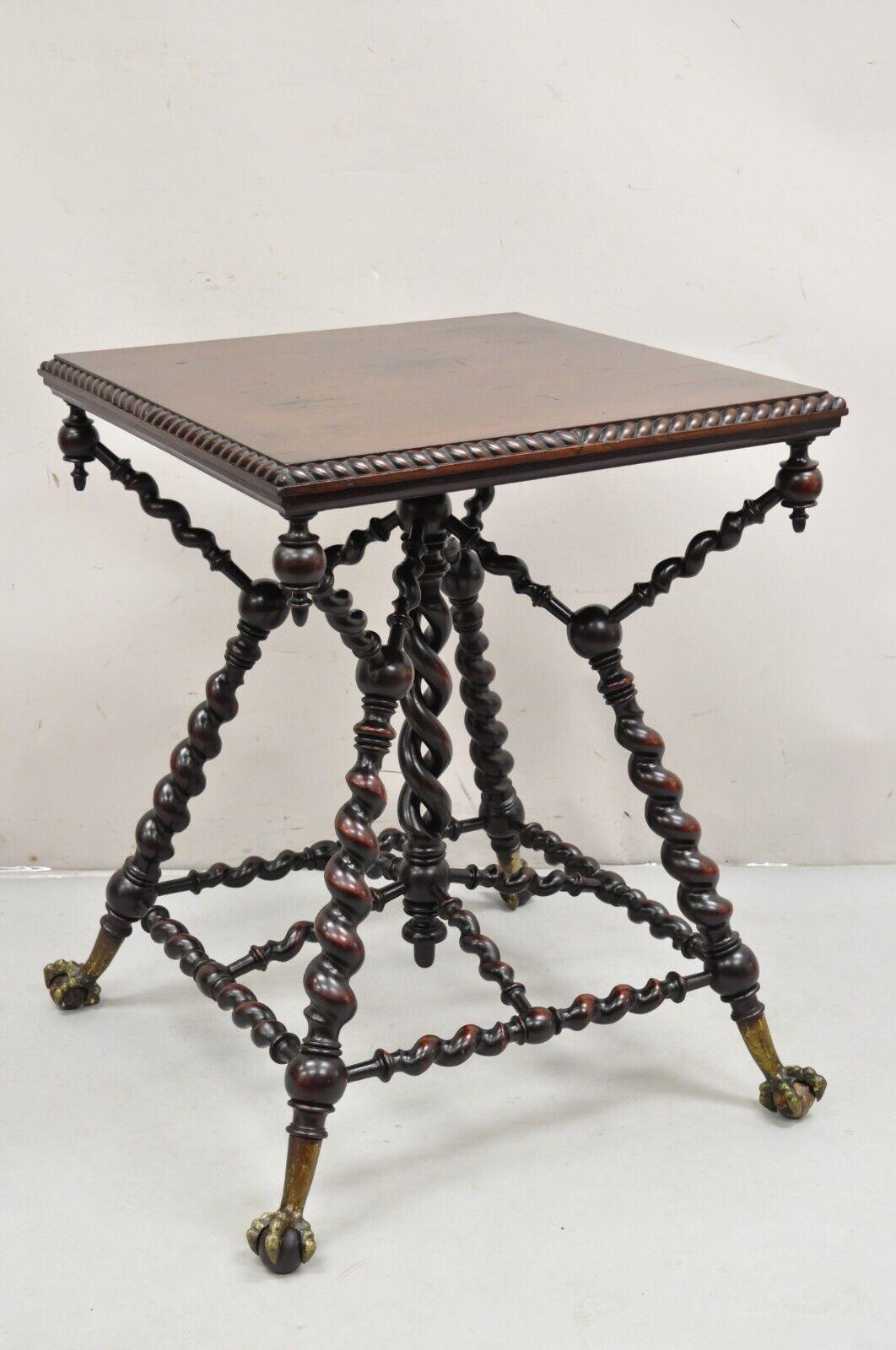 Antique Merklen Brothers Victorian Barley Twist Mahogany Occasional Parlor Table. Item featured is a very rare model with more dramatic barley twist legs and stretchers, ball and claw feet, carved roped edge, pointed finials, 