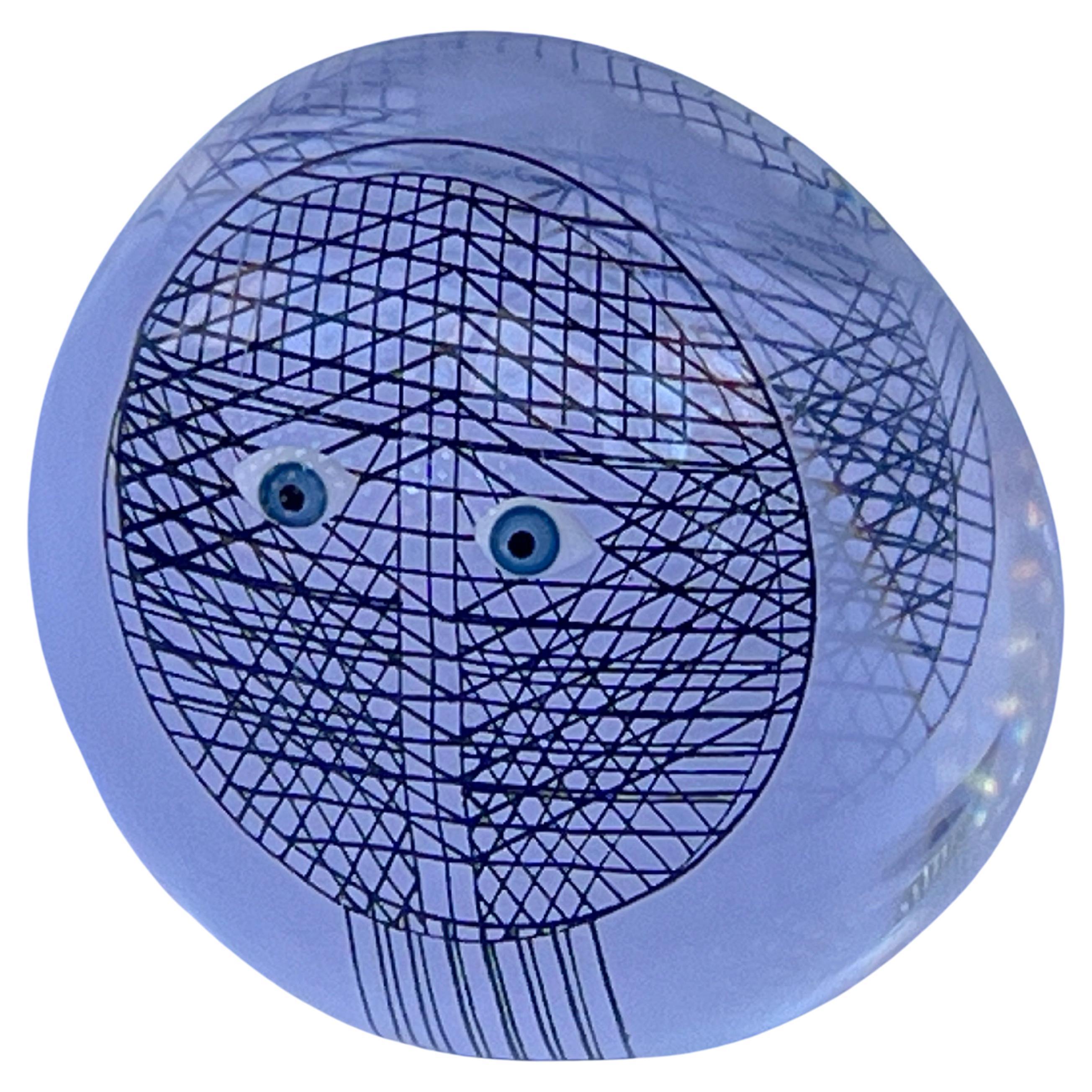 A vintage circa 1970's op-art style paperweight in lucite or acrylic featuring two piercing blue eyes set against a black grid like background by Merle Edleman. Anyone else thinking of the movie Tron or have I dated myself? This well designed desk