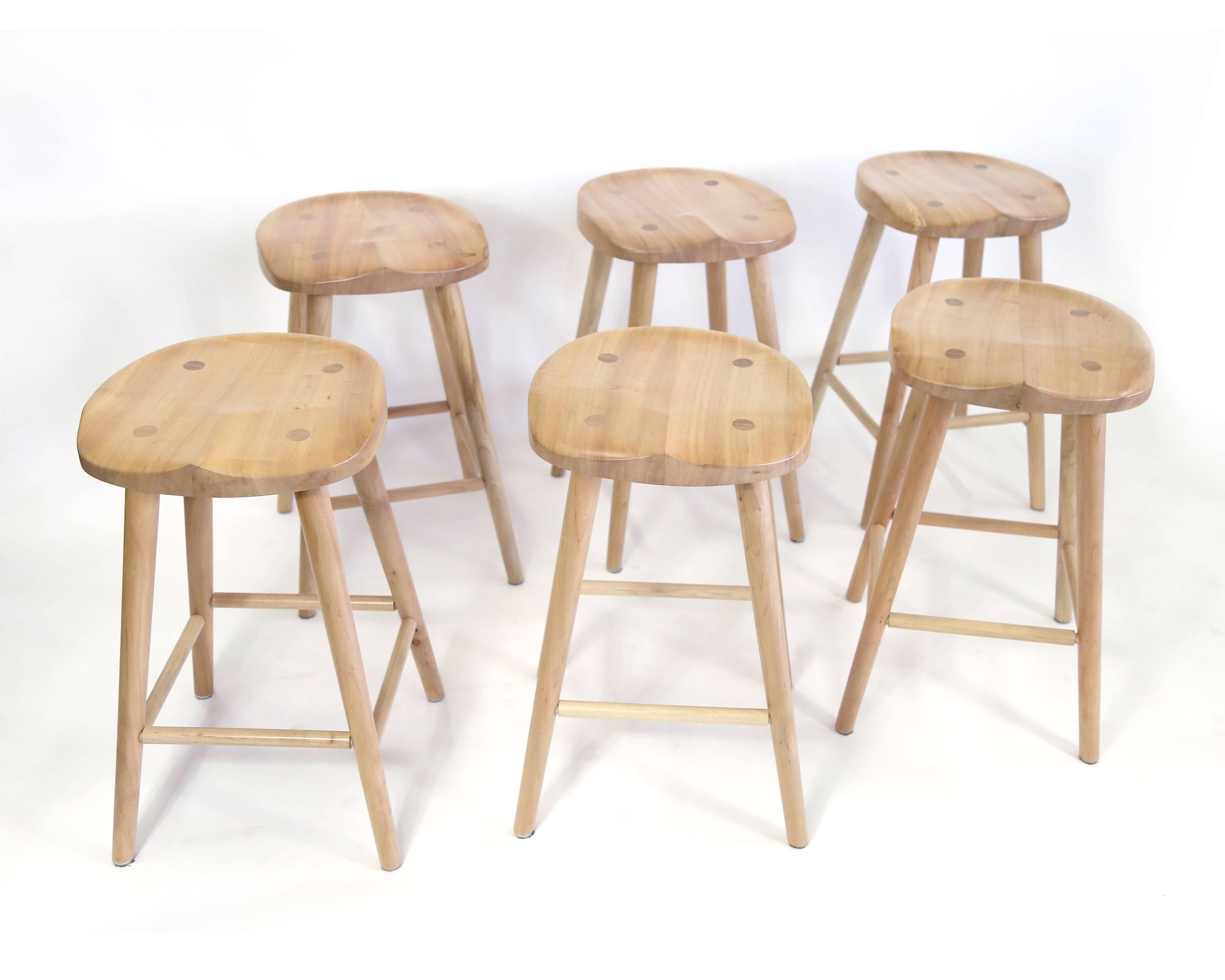 This simple barstool is quite comfortable, and the hand-carved seat keeps you in place for saddling up to the bar for the long haul. These are handmade by Pennsylvania Dutch woodworkers. Set of six existing stools that are like new. Photos are of