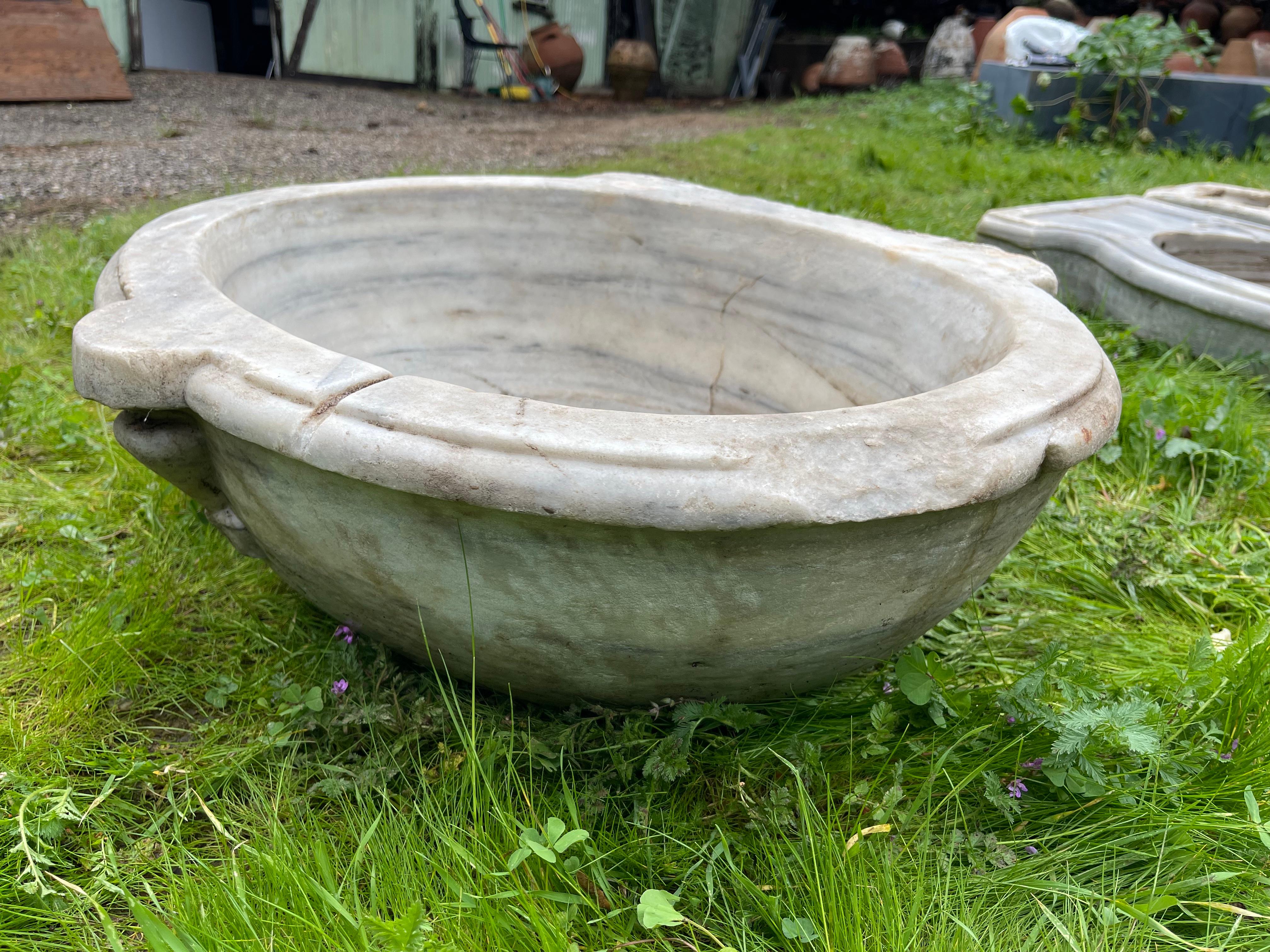 This vintage marble sink features hand-carved details that transport one to the communal bathhouses of the Ottoman Empire, called hamams. This sink features an oval basin and one front ear. 

Hamams are lined with taps, marble sinks, and marble