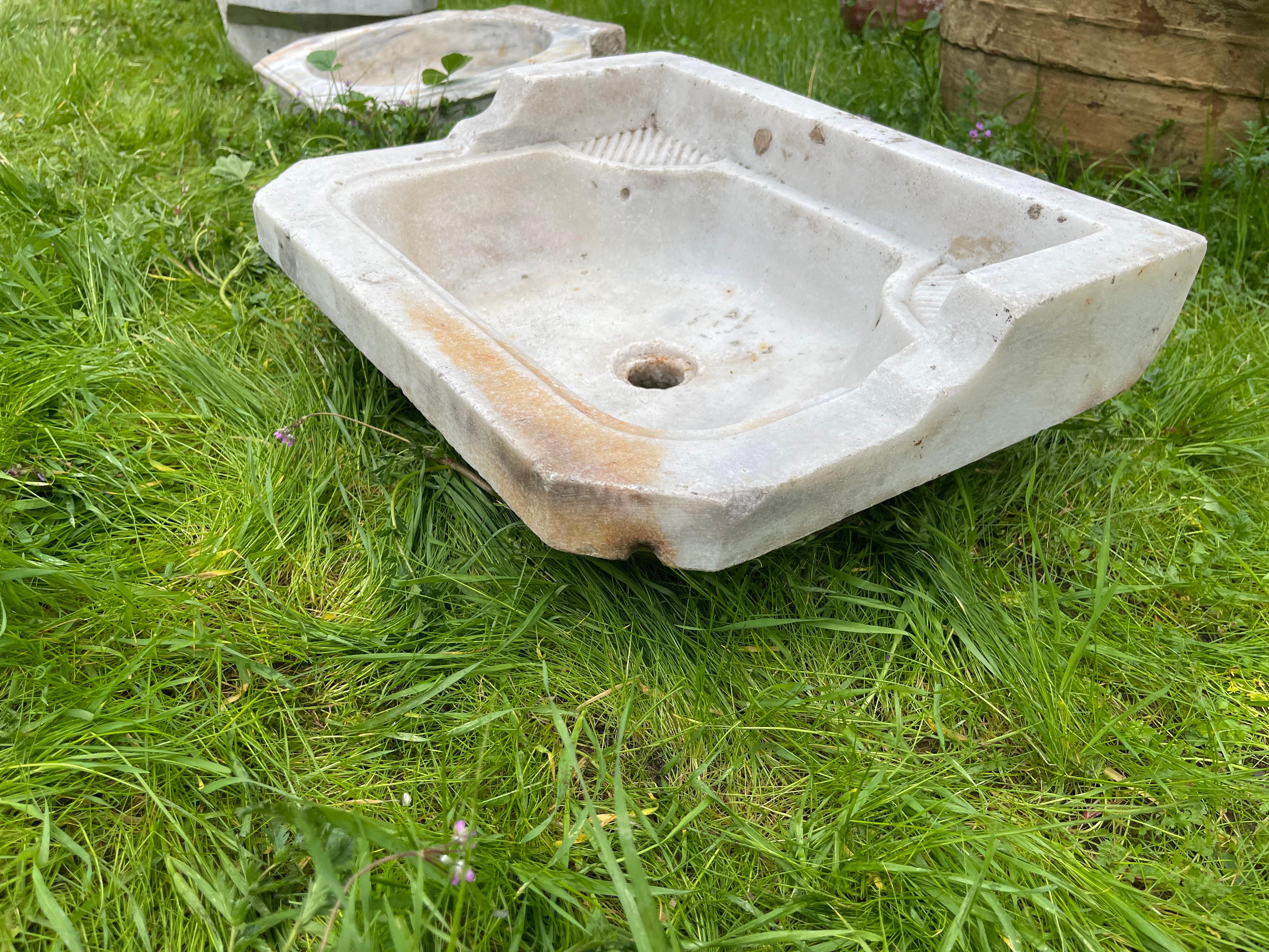 This vintage marble sink features hand-carved details that transport one to the communal bathhouses of the Ottoman Empire, called hamams. This sink features a rectangle shape and wide countertops with elegant drains. 

Hamams are lined with taps,