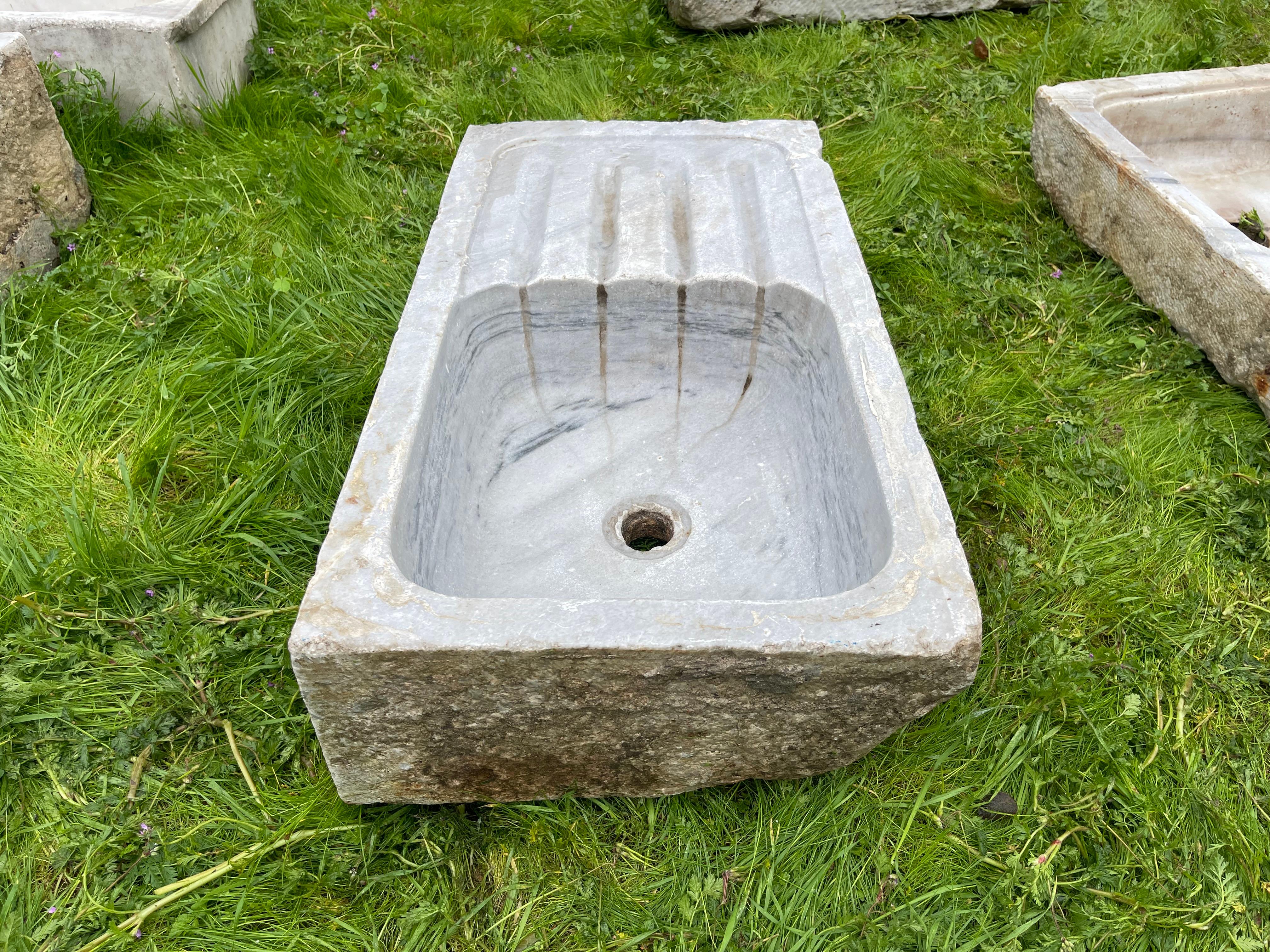 This vintage marble sink features hand-carved details that transport one to the communal bathhouses of the Ottoman Empire, called hamams. This sink features a beautiful round basin and shell-shaped walls. 

Hamams are lined with taps, marble sinks,