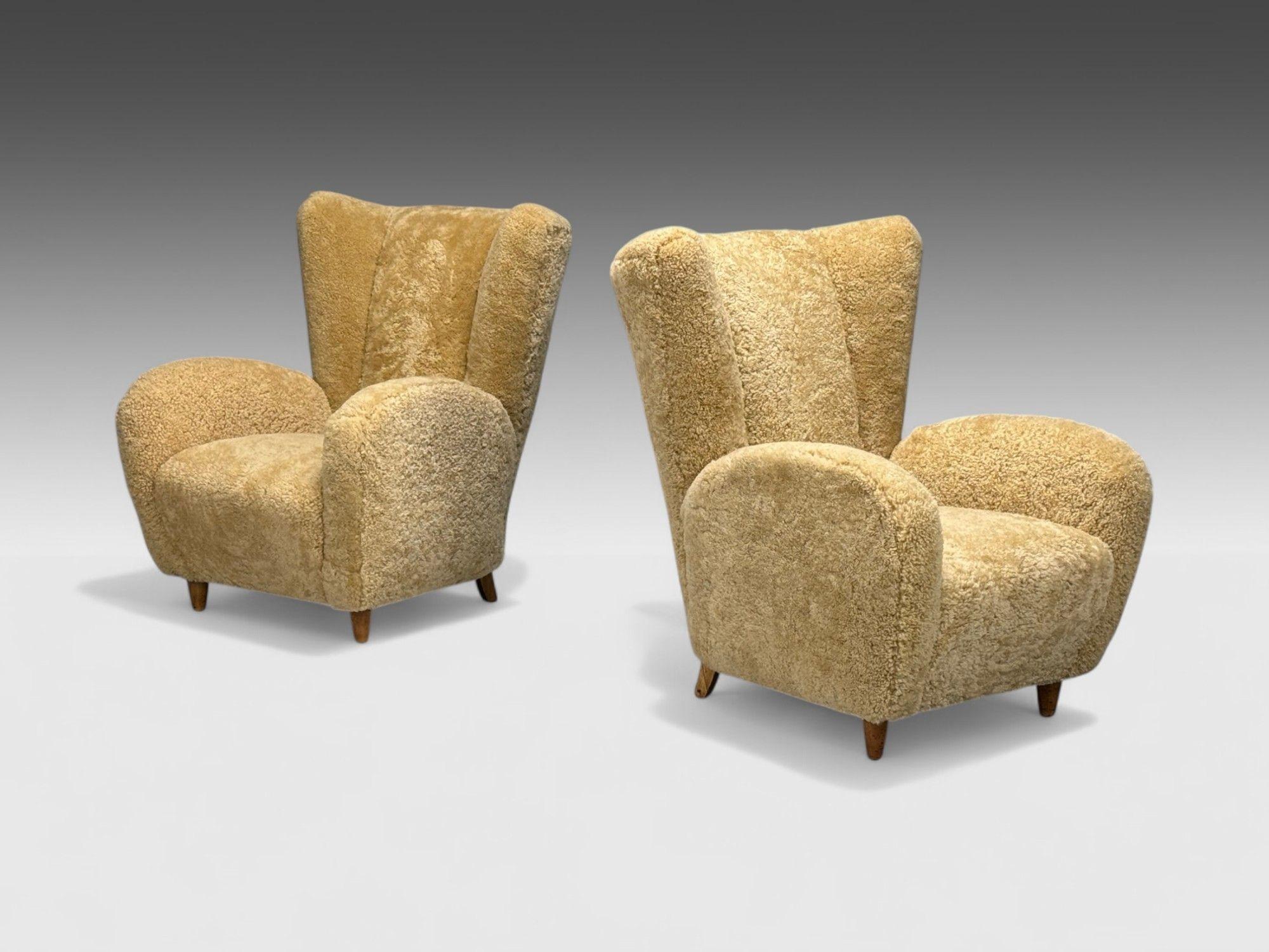 Meroni & Fossati Attribution, Beige Sheepskin, Stained Wood, Organic Lounge Chairs, Italy, 1950s

Pair of large organic form lounge chairs attributed to Meroni & Fossati and produced in Italy in the middle of the 20th century. Each example has been