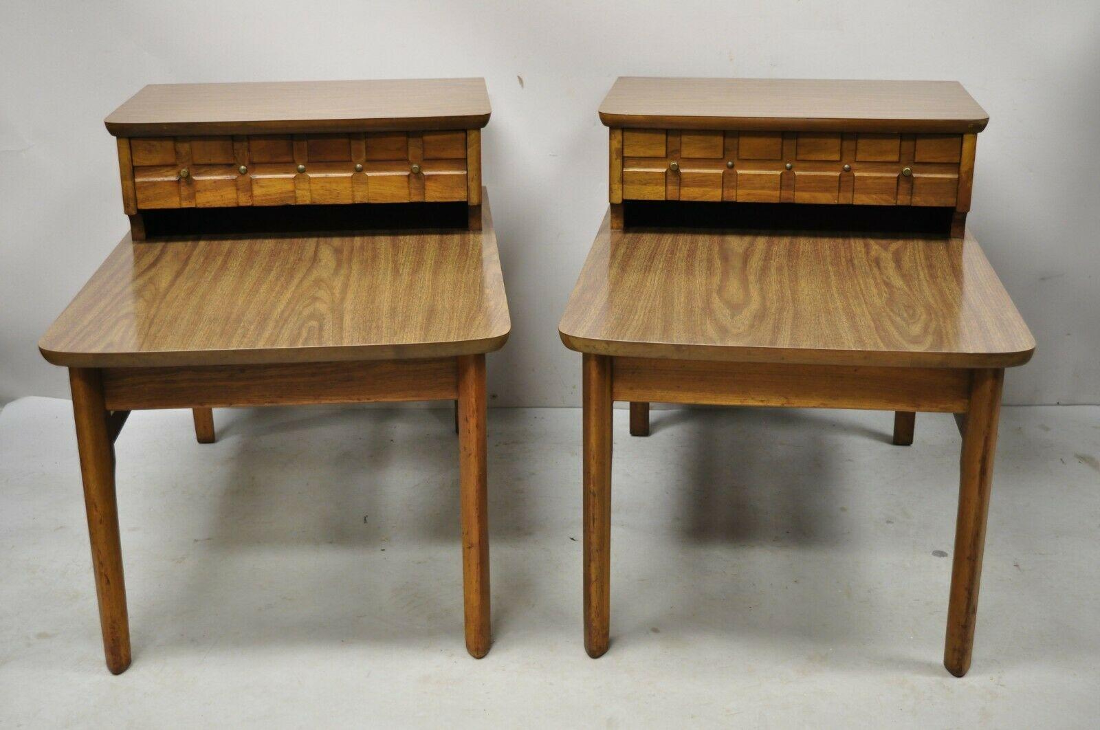 Mersman Mid Century Modern Walnut and Laminate Step End Tables - a Pair. Item features 2 tier laminated tops, stretcher base, original label, 1 dovetailed drawer, very nice vintage pair, quality American craftsmanship, great style and form. Circa