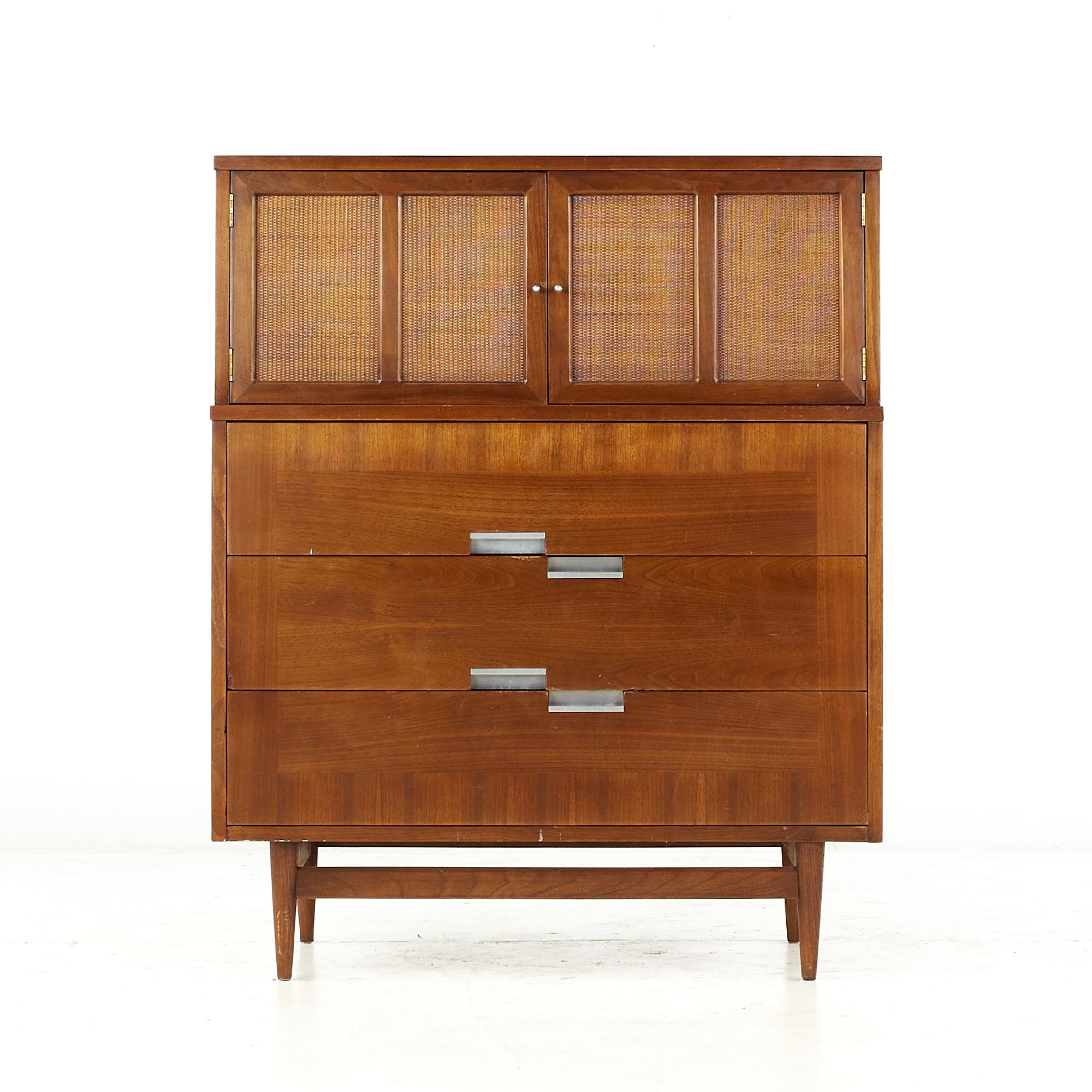 Merton Gershun for American of Martinsville Mid Century Walnut and Cane Front Highboy dresser

This dresser measures: 36 wide x 18.5 deep x 44.5 inches high

All pieces of furniture can be had in what we call restored vintage condition. That