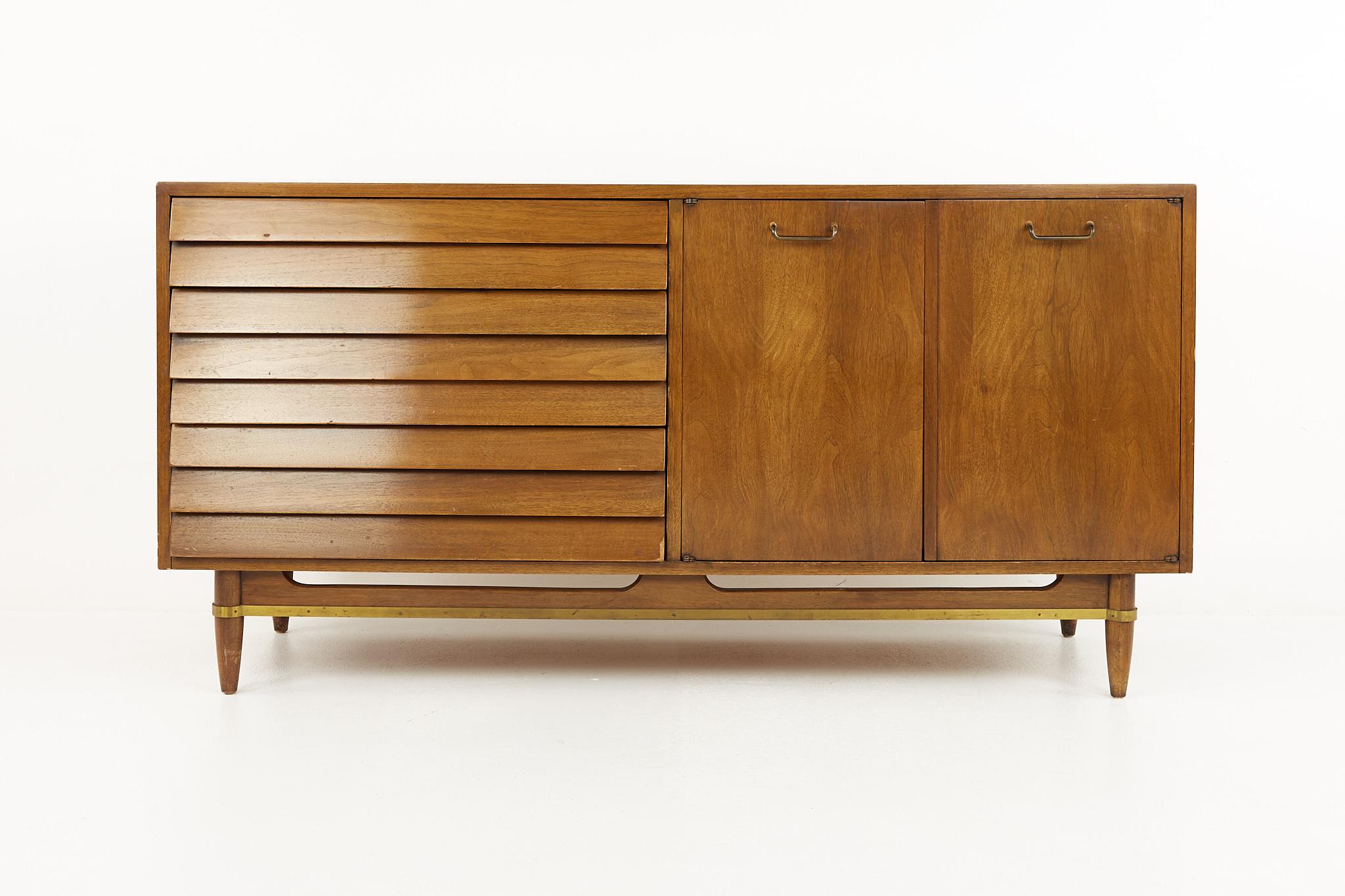 Merton Gershun for American of Martinsville Mid Century Louvered Walnut Dresser Credenza

This credenza measures:  60 wide x 19.5 deep x 30.25 inches high

All pieces of furniture can be had in what we call restored vintage condition. That means the