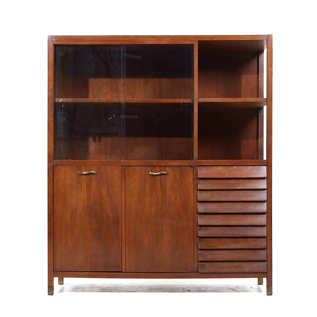 Merton Gershun for American of Martinsville Mid Century Walnut and Brass China Cabinet

This china cabinet measures: 50 wide x 18 deep x 57.75 inches high

All pieces of furniture can be had in what we call restored vintage condition. That means the