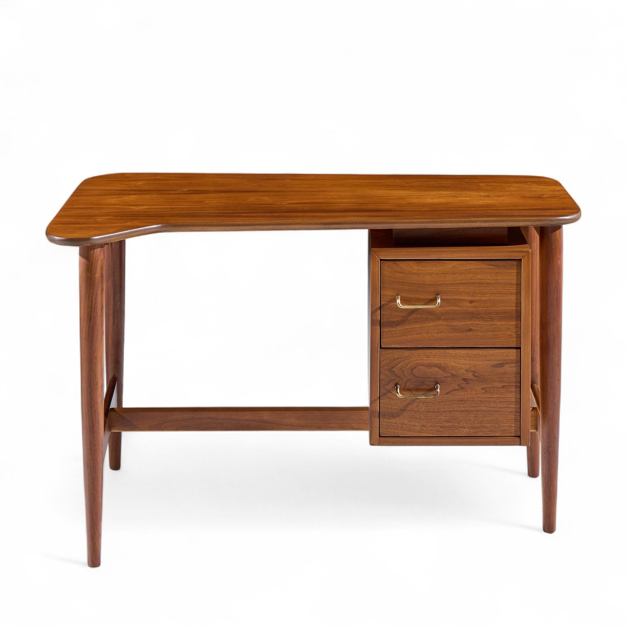 Merton Gershun for American of Martinsville Mid Century Walnut Curved Top Desk

This desk measures: 47 wide x 29 deep x 29 high, with a chair clearance of 28.25 inches

Restored - Mint Condition! Ready To Ship.

We take our photos in a controlled