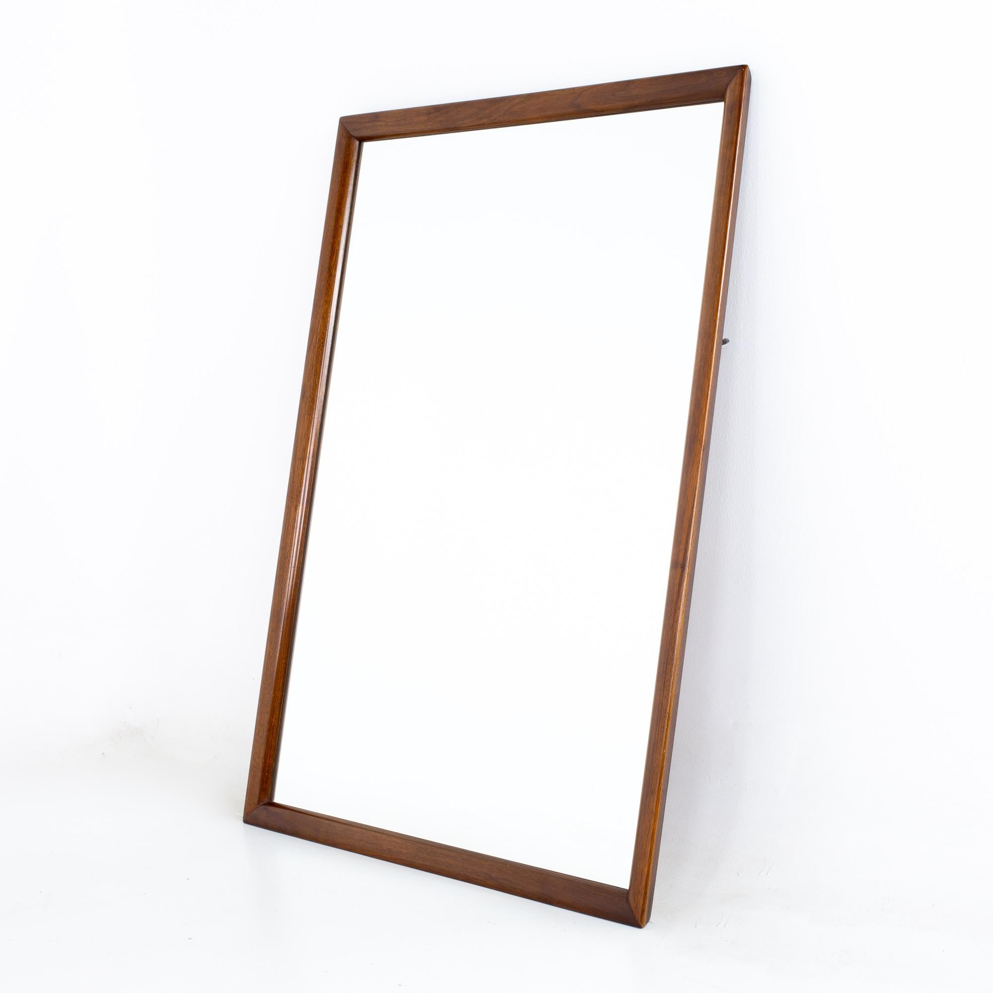 Merton Gershun for American of Martinsville mid century walnut mirror.
Mirror measures: 32.5 wide x 1.5 deep x 46.75 inches high

All pieces of furniture can be had in what we call restored vintage condition. That means the piece is restored upon