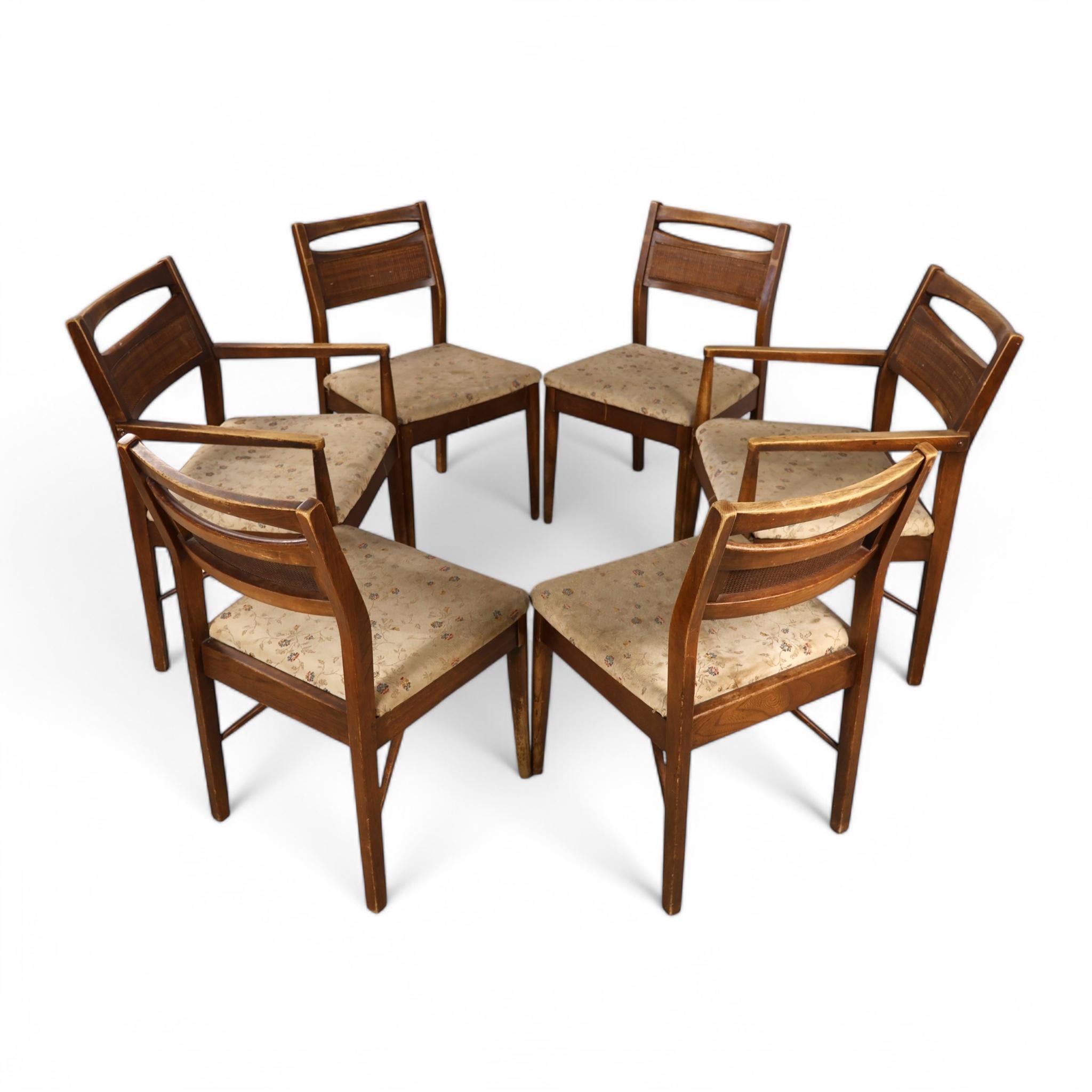 This vintage set of six mid-century modern dining chairs by Merton Gershun for American of Martinsville showcases clean lines and elegant craftsmanship from the 1960s. The set includes four side chairs and two armchairs, each featuring solid wood