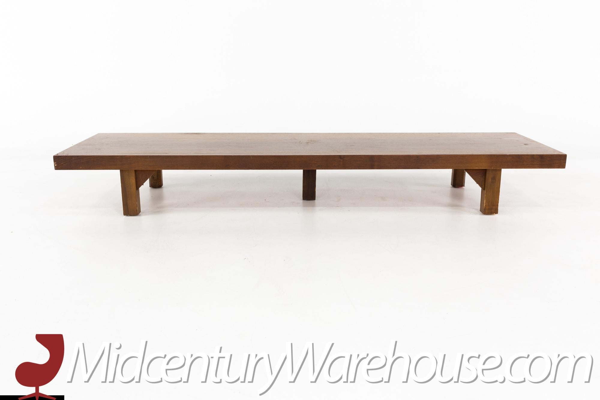 Merton Gershun For American of Martinsville style mid century walnut coffee table bench

This bench measures: 61.5 wide x 17.5 deep x 8 inches high

All pieces of furniture can be had in what we call restored vintage condition. That means the