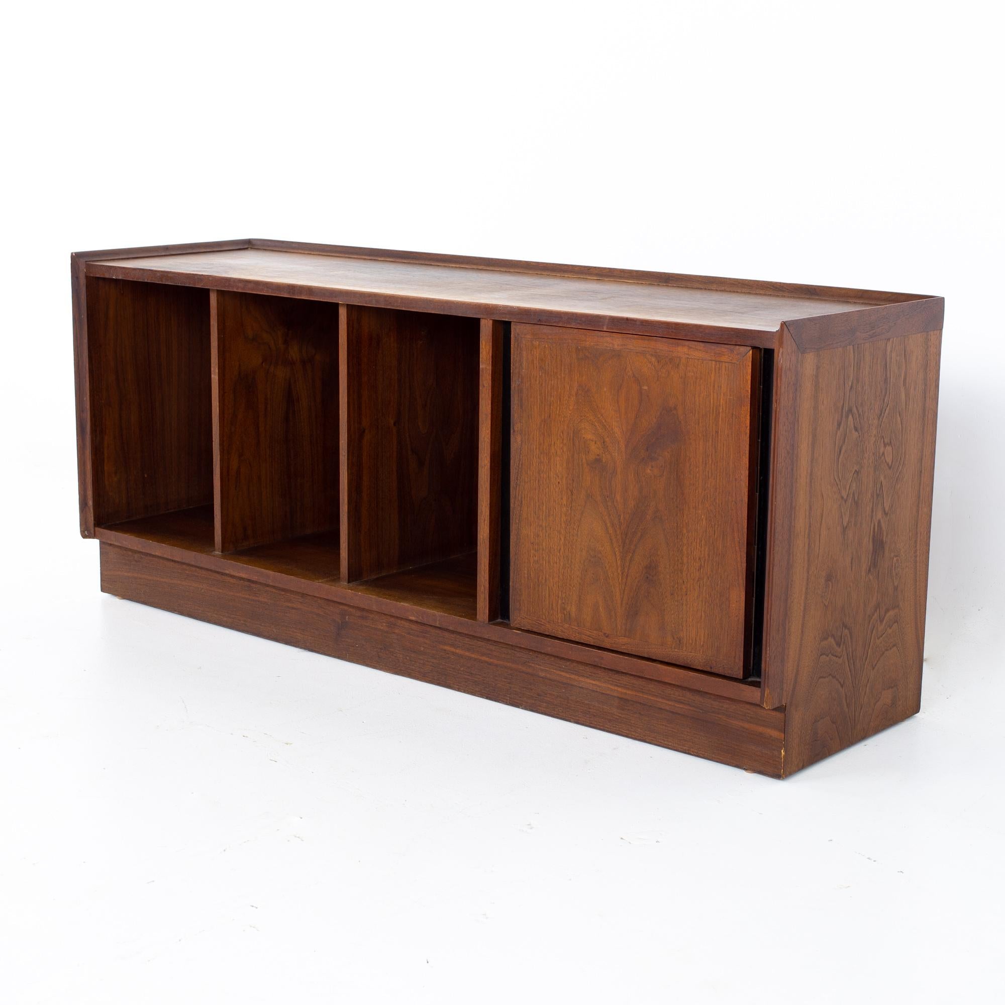 Merton Gurshun Dillingham Esprit Mid Century record cabinet bench
Cabinet measures: 48 wide x 13.25 deep x 20 inches high

All pieces of furniture can be had in what we call restored vintage condition. That means the piece is restored upon