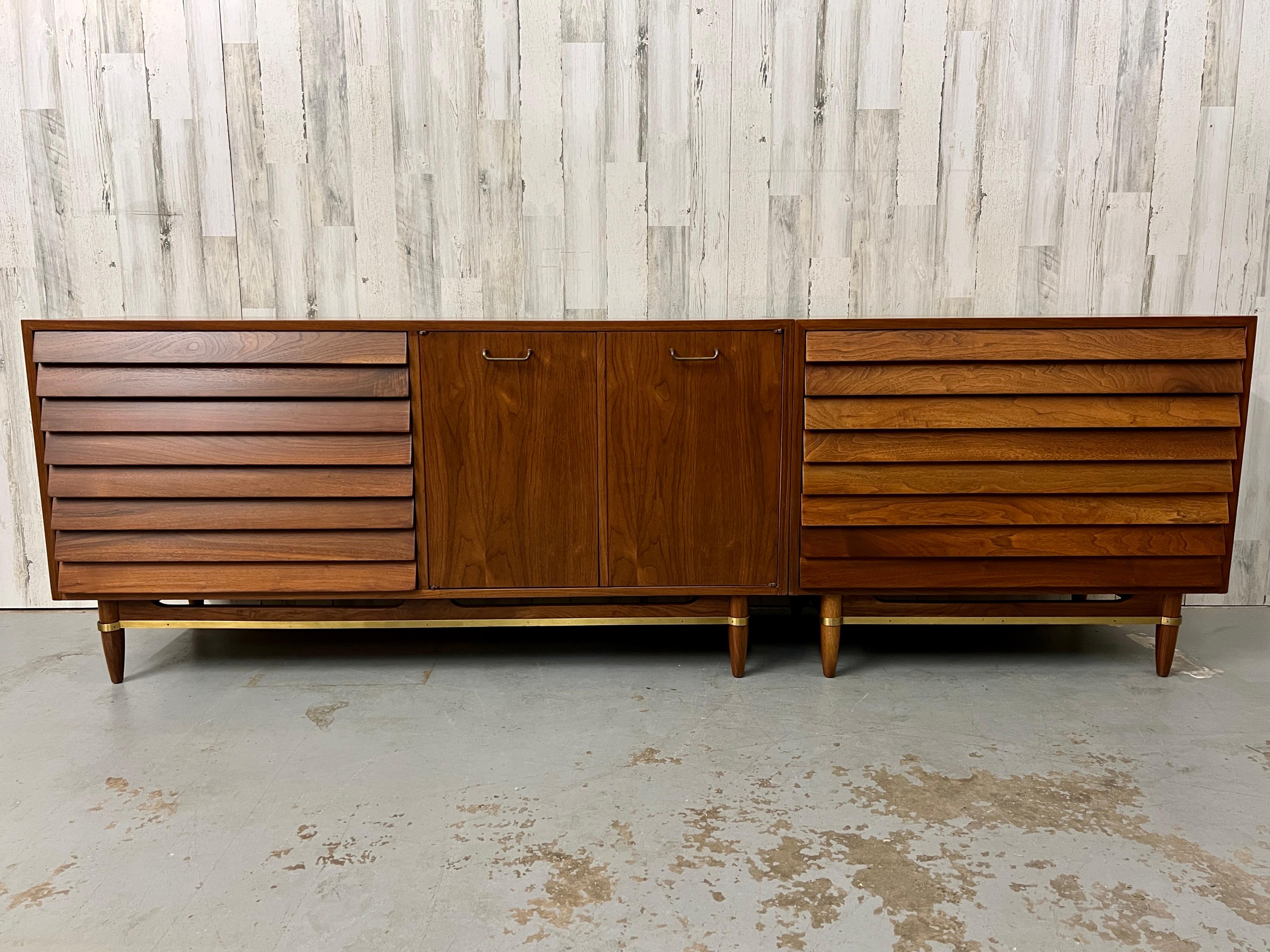 Rare two piece set  with louvered drawers on each side and additional drawers inside the center doors, Satin finish on the walnut really brings out the deep walnut tone.
These two cabinets can be used together or seperate.
Large cabinet 60 wide x