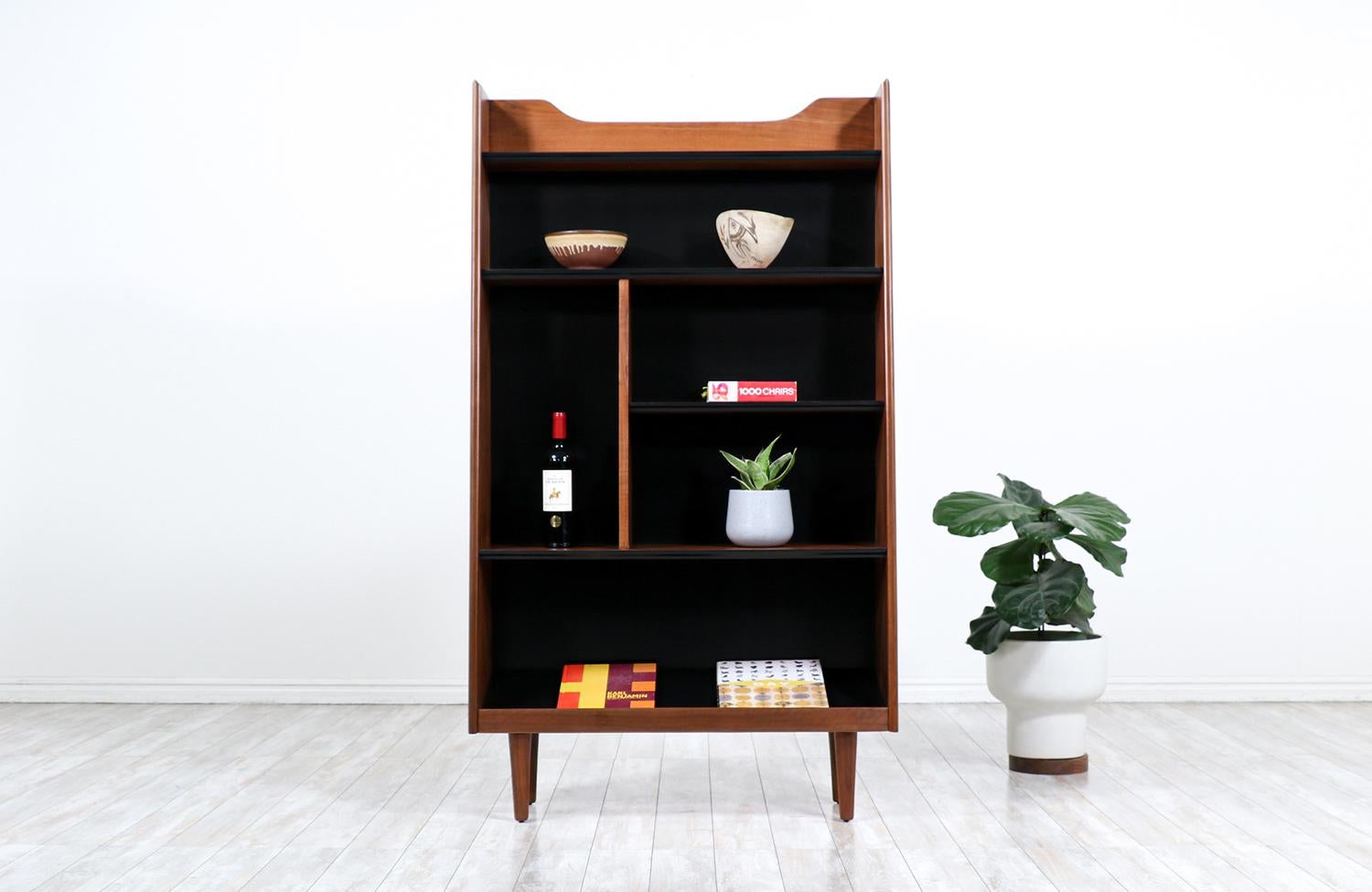 Merton L. Gershun free-standing taper bookshelf for Dillingham.

________________________________________

Transforming a piece of Mid-Century Modern furniture is like bringing history back to life, and we take this journey with passion and