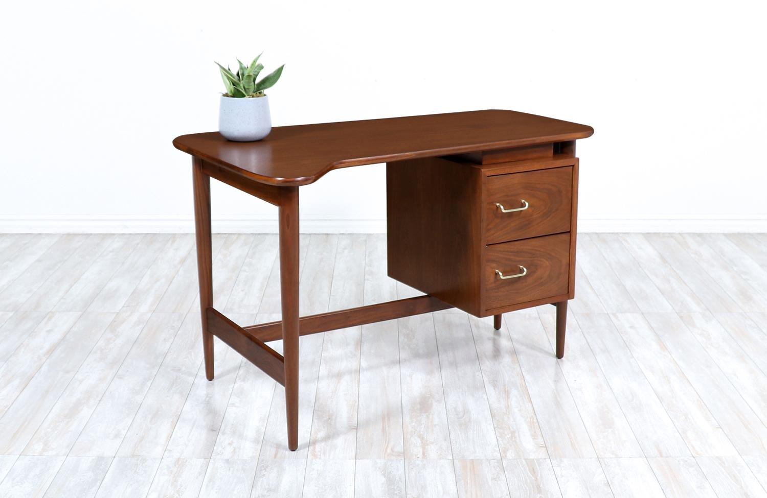 Merton L. Gershun walnut writing desk for American of Martinsville.

________________________________________

Transforming a piece of Mid-Century Modern furniture is like bringing history back to life, and we take this journey with passion and