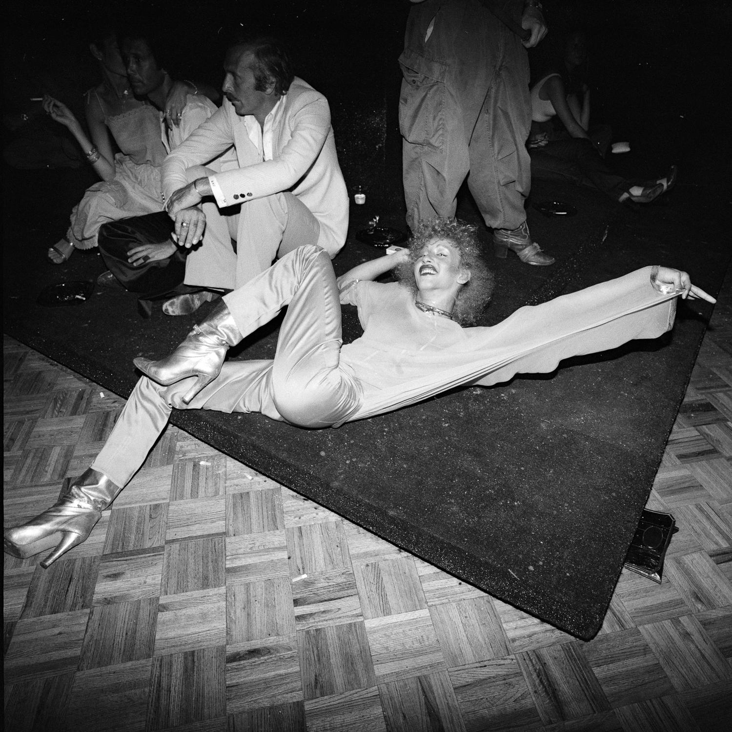Nicole’s Silver Boots Stretched on Floor, Studio 54 - Photograph by Meryl Meisler