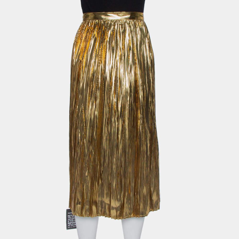 Show your love for contemporary fashion by donning this fabulous midi skirt from Mes Demoiselles. It comes designed in gold silk and lurex and features a pleated silhouette. It is equipped with a zip closure and will look amazing with off-shoulder