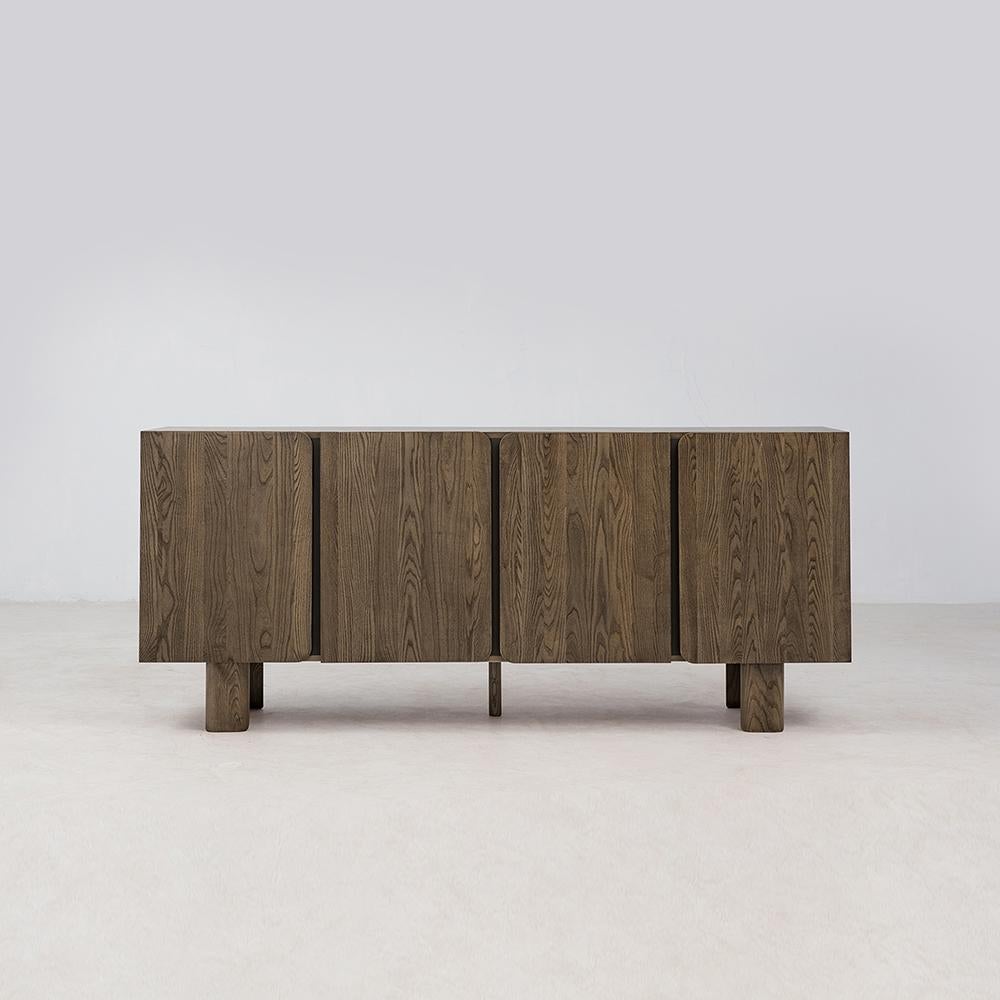 Solid FSC Certified American White Ash, rounded corners, soft close doors, and leather details make for a delightful combination in the Mesa Sideboard. Slim and elegant legs gently taper to the ground for a balanced and easygoing silhouette. Wire