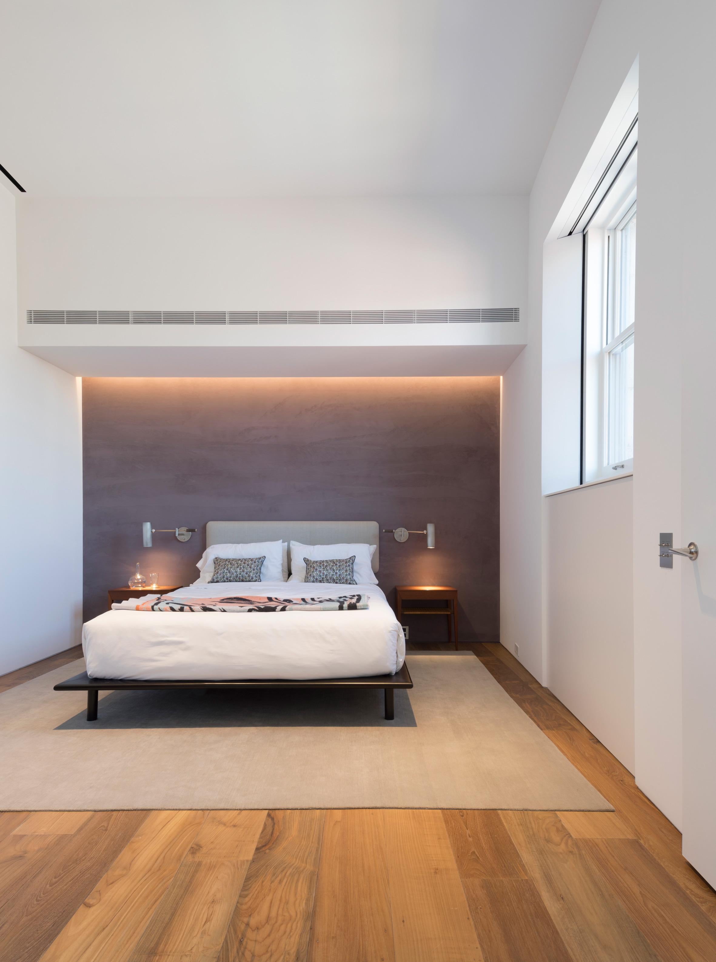 The Mesa bed features a low lying bed frame made of hand-shaped ebonized and lacquered maple or natural oak or walnut with inset round legs. Mattress support made of hardwood slats, box spring not required.

Available in full, king, and queen