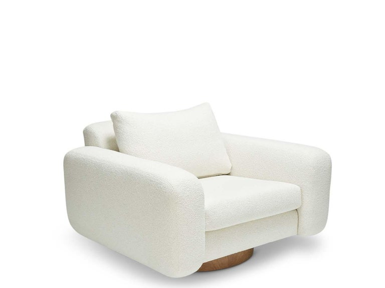 Mesa swivel chair by Lawson-Fenning in white Alpaca Boucle. The Mesa swivel chair is a fully upholstered club chair that features a walnut or oak inset base.

The Lawson-Fenning Collection is designed and handmade in Los Angeles, California. Reach