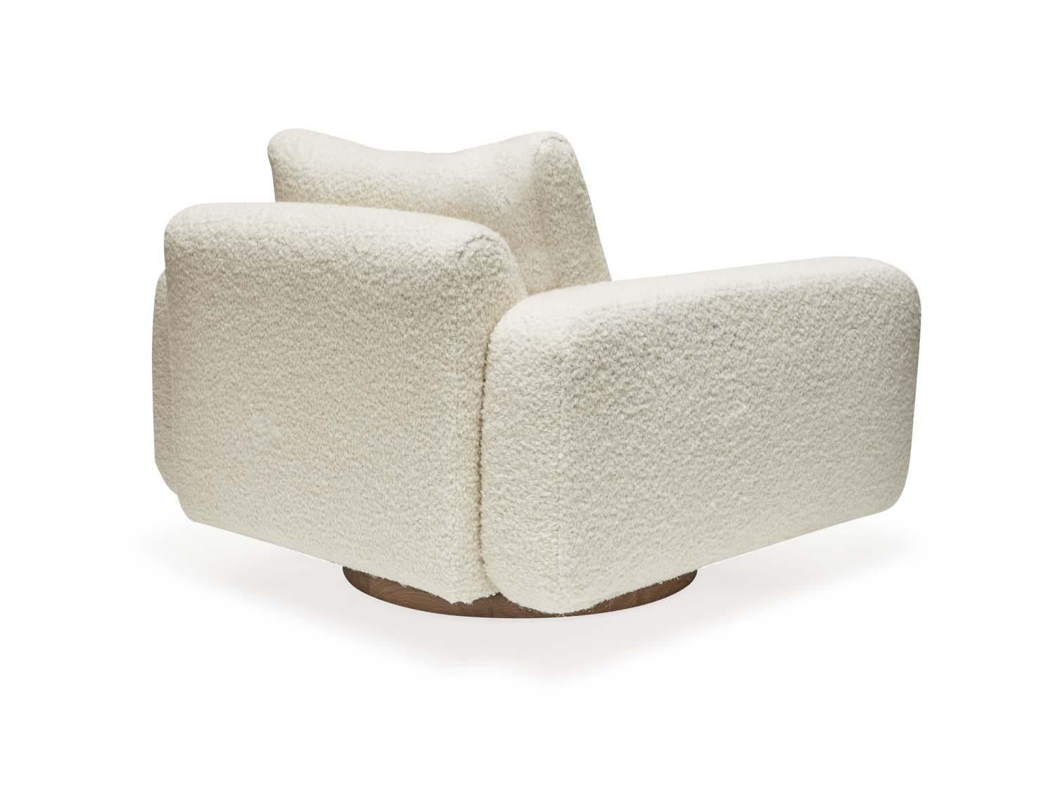 Mesa swivel chair by Lawson-Fenning in white Alpaca Boucle. The Mesa swivel chair is a fully upholstered club chair that features a walnut or oak inset base.

The Lawson-Fenning Collection is designed and handmade in Los Angeles, California. Reach