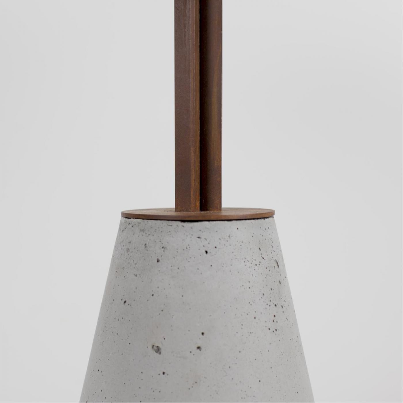 UM table with concrete base and corten steel top