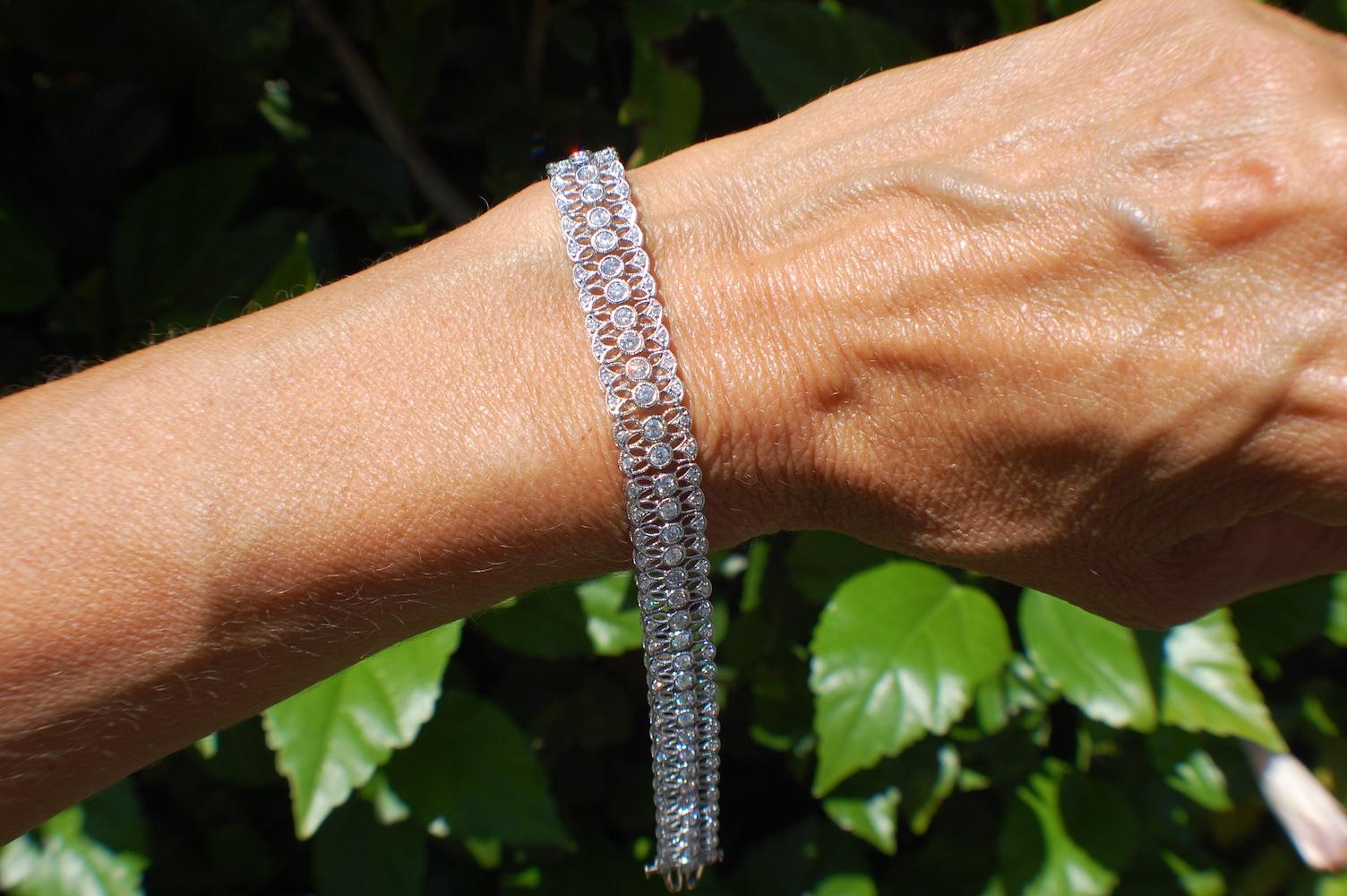 Mesh, Diamond Modern Style Tennis 3.08 Carat Bracelet, 18 Karat White Gold
This sticking bracelet is gorgeous and  covered with diamonds down the center set in bezel settings and along the edge of each side. The diamond weight is estimated at 3.08