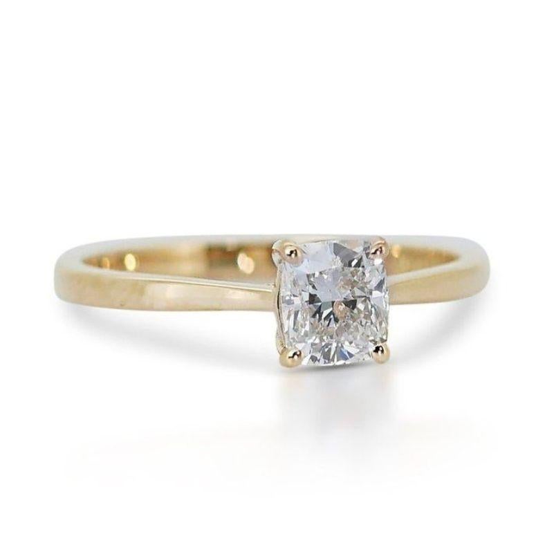 This exquisite ring captures the timeless elegance of a single, captivating diamond. The centerpiece is a mesmerizing 1.02 carat round brilliant diamond, boasting a warm G color (near colorless) and exceptional VVS1 clarity (minute inclusions barely