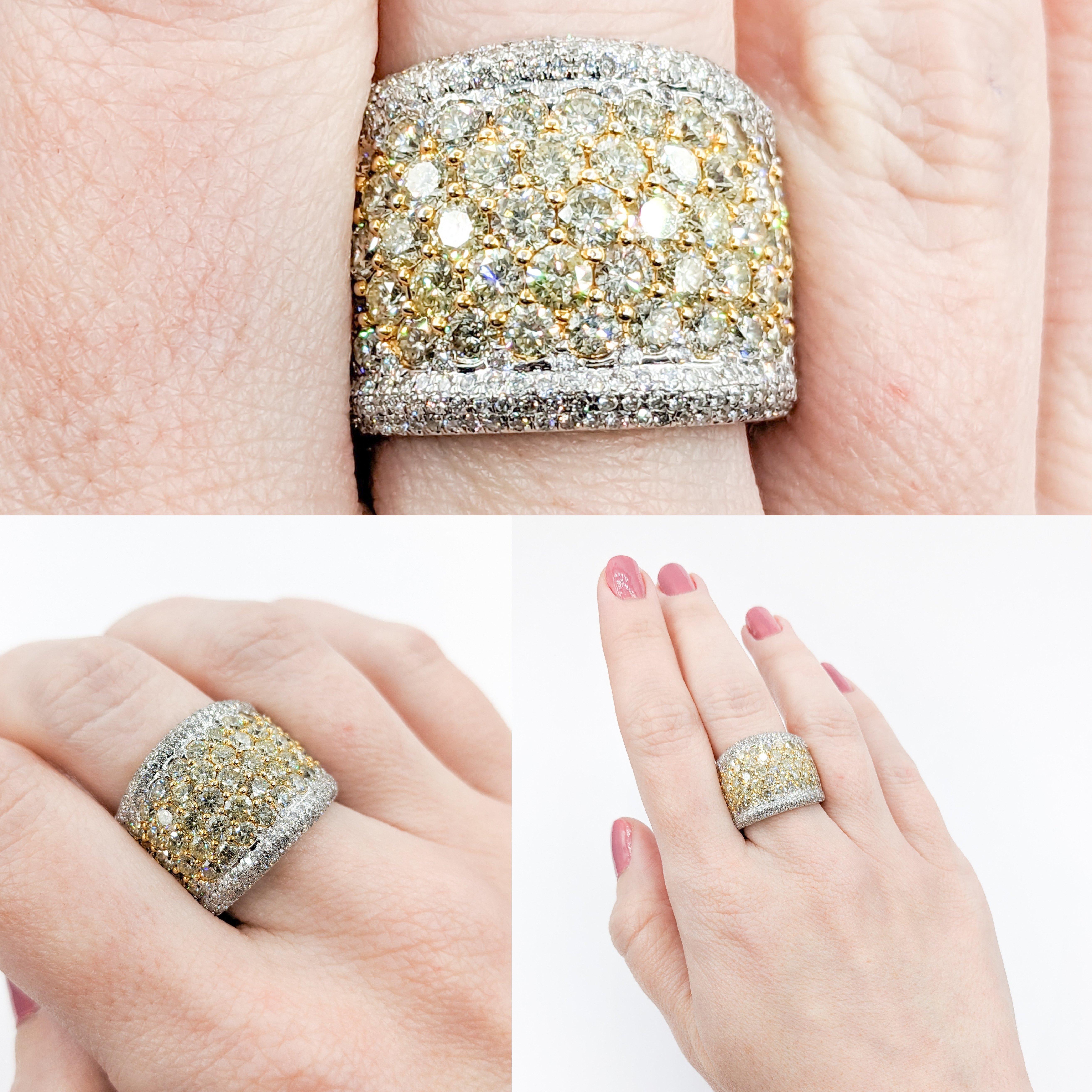 Mesmerizing 4.40ctw Yellow Diamond Pave Wide Band Ring

Embodying opulence, this 18k white and yellow gold wide band ring features a staggering 4.40ctw of round yellow & white diamonds. These vibrant diamonds, set in a pave style, boast SI clarity