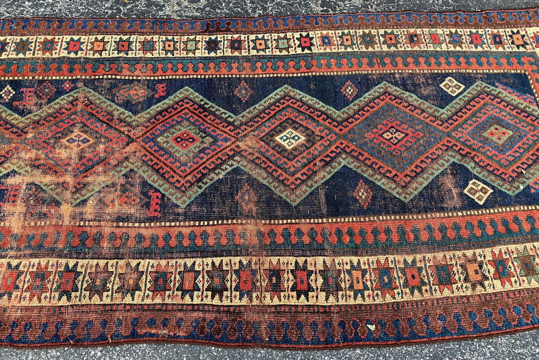 Jommi Mesmerizing Geometric Antique Tribal Rug Wide Runner

About this rug: Such an incredible rug, one of my top 5 rugs we have for sure! Deep indigo blue that allows the minty greens, chocolate browns, and blushy rusts to pop! Super casual and